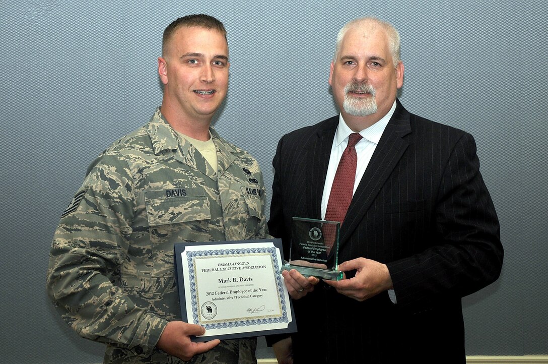 U.S. Air Force Tech. Sgt. Mark Davis, 55th Intelligence Support Squadron, is presented the Omaha-Lincoln Federal Executive Association's 2012 administrative and technical employee of the year award by Keith Reid, FEA president, May 16 at the University of Nebraska at Omaha's Thompson Alumni Center. The FEA award program is open to all federal employees, including both military and civilian, in the Omaha-Lincoln area. (courtesy photo)