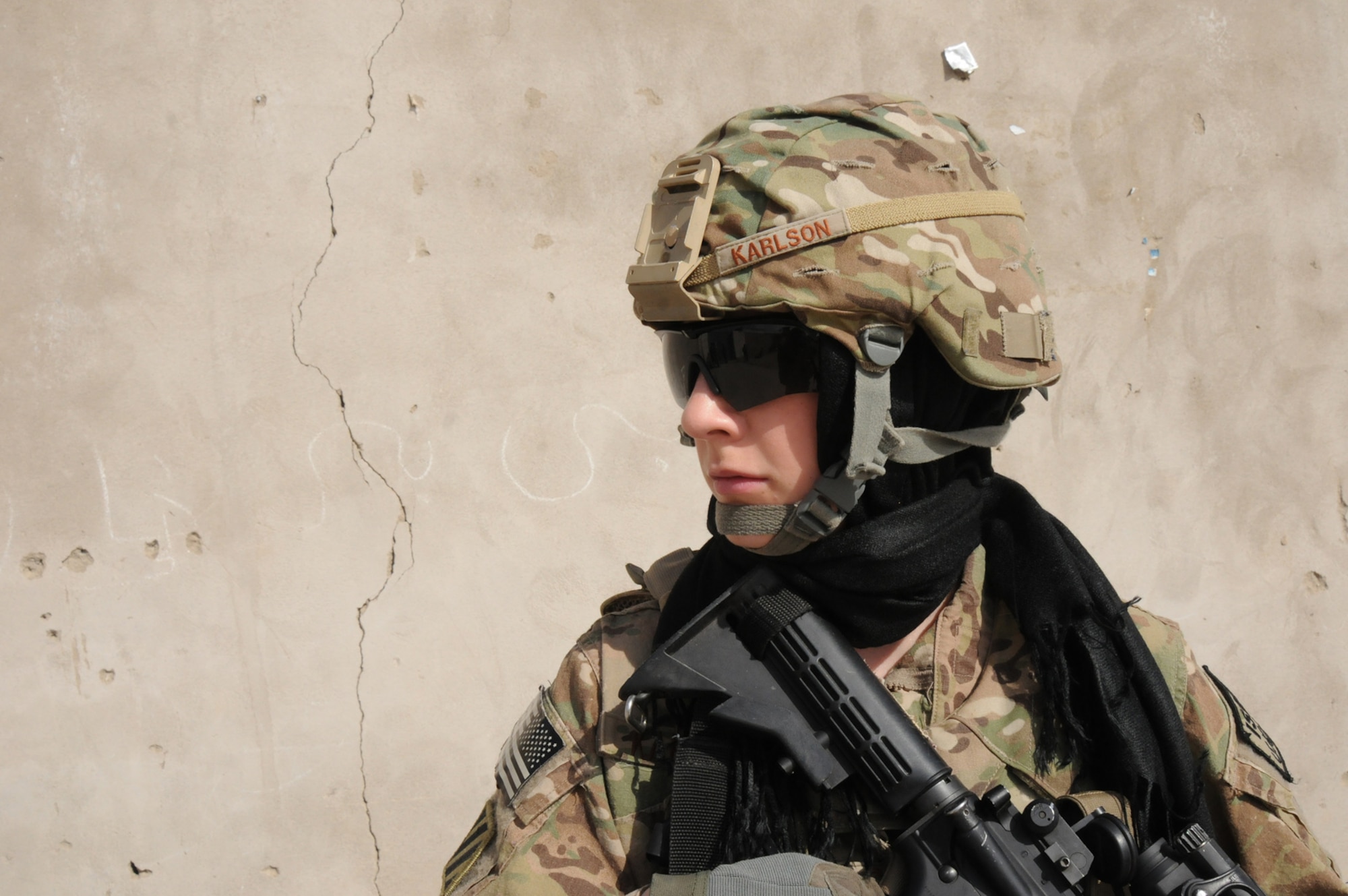 U.S. Air Force Senior Airman Karley Karlson, Zabul Provincial Reconstruction Team medic and Female Engagement Team member, pulls security at a FET event in Qalat City, Zabul Province, Afghanistan, Feb. 19, 2013. Karlson deployed from the 366th Surgical Operations Squadron, Mountain Home Air Force Base, Idaho, and her primary job while deployed was to gather information, communicate and assist women with Afghan female-related issues, and she also executed her primary skillset of a medic in the PRT clinic.  (U.S. Air Force photo by Staff Sgt. Patrice Clarke/RELEASED)