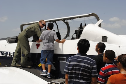 Participants in the Tuskegee Airmen Incorporated Youth Seminar learn about the T-6 Texan II, June 21, 2013 at Joint Base San Antonio-Randolph, Texas. During their time on base, the youth learned about the legacy of the Tuskegee Airmen and aviation.  (U.S. Air Force photo by Bekah Clark)