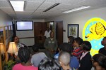 Lt. Col. Gavin Marks, 99th Flying Training Squadron commander, speaks with participants in the Tuskegee Airmen Incorporated Youth Seminar, June 21, 2013 at Joint Base San Antonio-Randolph, Texas.  During their time on base, the youth learned about the legacy of the Tuskegee Airmen and aviation.  (U.S. Air Force photo by Bekah Clark)