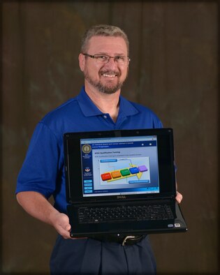 John Hawk is the I.G. Brown Training and Education Center's creator of Advanced Distributive Learning products for the Air National Guard. He sorts though loads of data, ideas, requirements and graphics to structure and develop online learning products for the total U.S. Air Force. (U.S. Air National Guard photo by Master Sgt. Kurt Skoglund/Released)