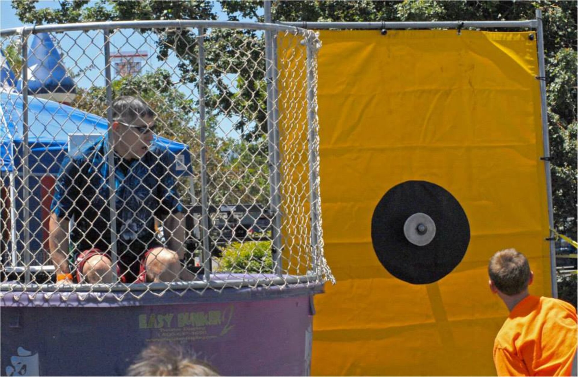 152AW CC Col. Burkett preparing to be "dunked" again during the Nevada National Guard's "Family Day" on Saturday, 22 June at the Air Base in Reno.  More than 2,000 Airmen, friends and family members attended the event.  NV ANG photo by Capt. Jason Yuhasz 152AW/PA (released).