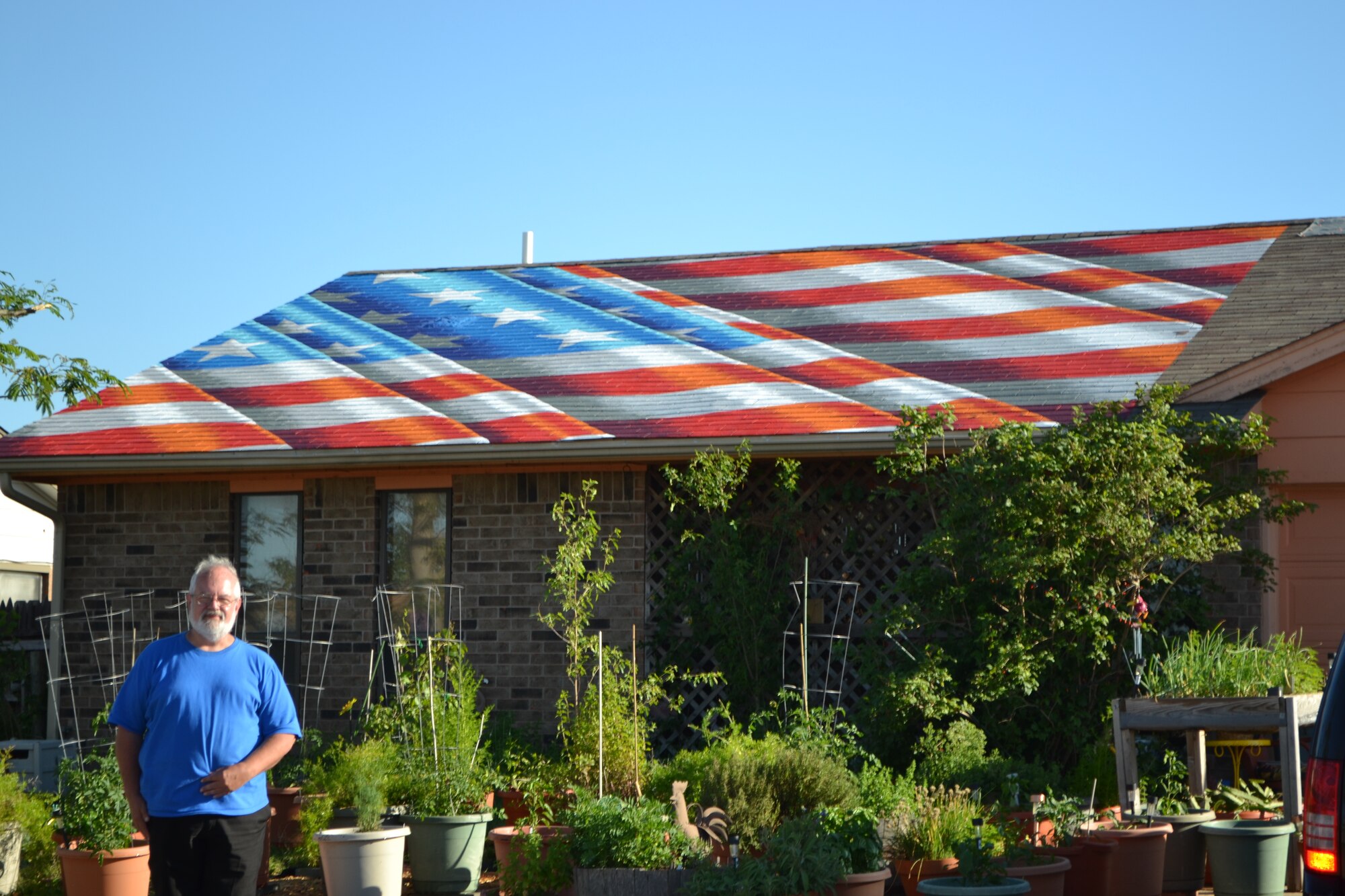 Edwin Kincaid, a subject matter expert technical lead within the Air Force Sustainment Center Engineering Directorate, said he and his wife, Edith, were honored to represent Moore when an artist from New York asked to paint a flag on their roof. (Air Force photo by April McDonald)