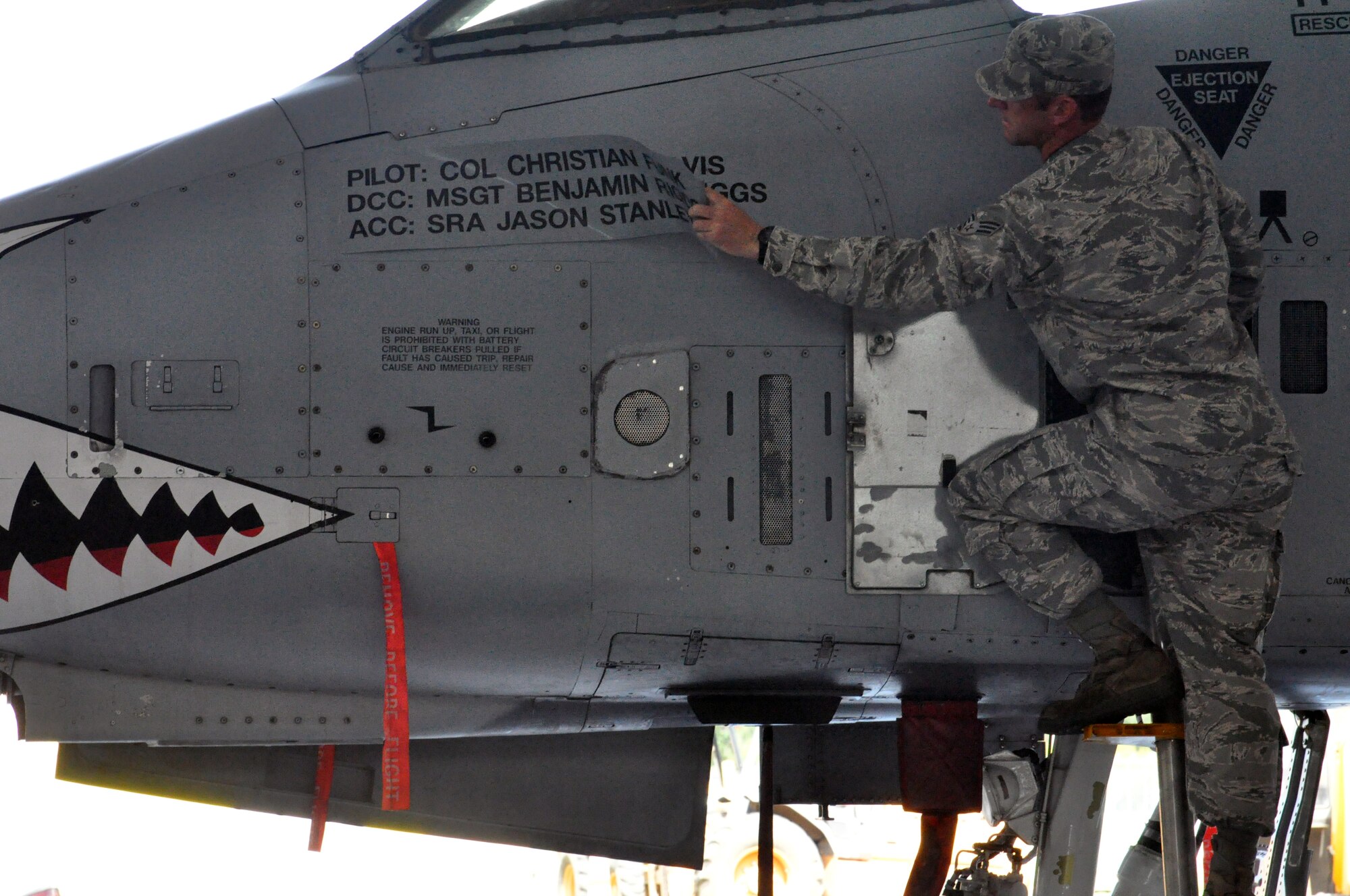 MOODY AIR FORCE BASE, Ga. -- Senior Airman Jason Stanley, 476th Maintenance Squadron crew chief, reveals the wing commander's aircraft during a change of command ceremony June 23, 2013. During the ceremony, Col. Christian Funk passed command of the group to Col. James Travis. The 476th Fighter Group is a geographically separated unit of the 442nd Fighter Wing, Whiteman AFB, Mo. The 442nd Fighter Wing is an A-10 Thunderbolt II Air Force Reserve unit. (U.S. Air Force photo by Tech. Sgt. Danielle Johnston/Released)