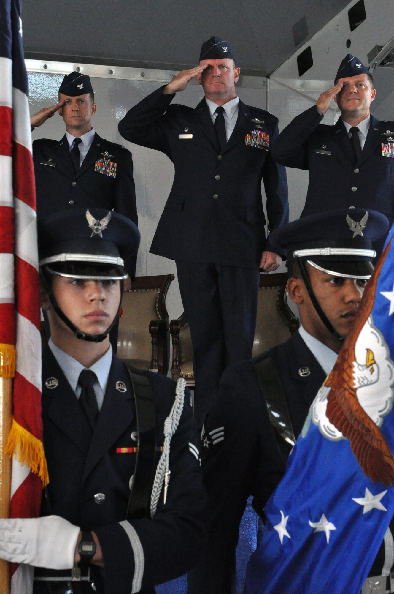 MOODY AIR FORCE BASE, Ga. -- Col. Hubert Hegtvedt, Col. Christian Funk, and Col. James Travis salute the flag while the honor guard posts the colors during a change-of-command ceremony here June 23, 2013. Hegtvedt presided over the ceremony in which Travis took command of the 476th Fighter Group from Funk. The 476th Fighter Group is a geographically separated unit of the 442nd Fighter Wing, Whiteman AFB, Mo. The 442nd Fighter Wing is an A-10 Thunderbolt II Air Force Reserve unit. (U.S. Air Force photo by Tech. Sgt. Danielle Johnston/Released)