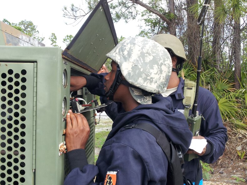 Senior Airman Krystopher Clarke, 507th Civil Engineer Squadron works on equipment at a Silver Flag exercise at Tyndall Air Force Base, Fla. May 18, 2013.  Twenty Nine CE Reservists “deployed” to a simulated location with the goal of setting up, establishing and running a fully operational base in a contingency environment. (U.S. Air Force Photo/Lt. Col. Patricia Pettine)