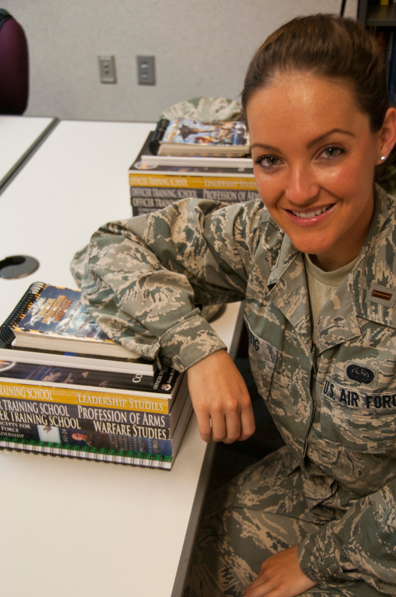 2nd Lt. Cara Lustig, Commissioned Officer Training kilo flight, sits in her
classroom June 21, one week before graduating from Officer Training School
at Maxwell AFB, Ala. Lieutenant Lustig, a prior service Reservist, will held
to Washington D.C., immediately after graduation to compete in the Miss
United States pageant July 2-7. (U.S. Air Force photo by Tech. Sgt. Sarah
Loicano)

