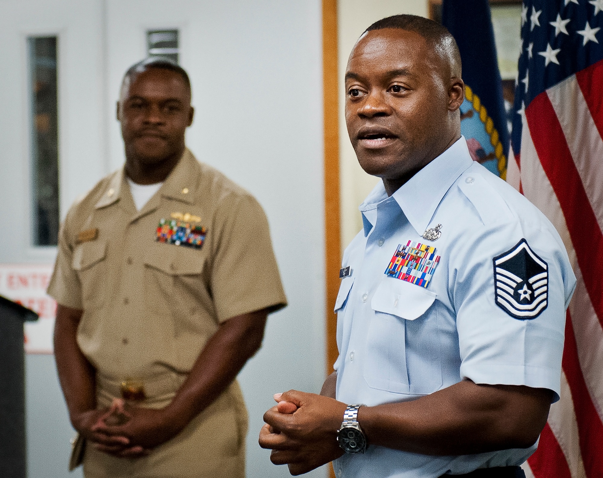 Master Sgt. Antone Scott, 96th Logistics Readiness Squadron, speaks about the opportunity to have his twin brother, Navy Lt. Cdr. Anthony Scott, administer the oath of enlistment to him June 27 at Eglin Air Force Base, Fla.  Due to their schedules and service commitments, this was the first time the twins had been able to participate in the time-honored tradition.  When Anthony became a naval officer, his brother Antone was the first one to salute him.  (U.S. Air Force photo/Samuel King Jr.)