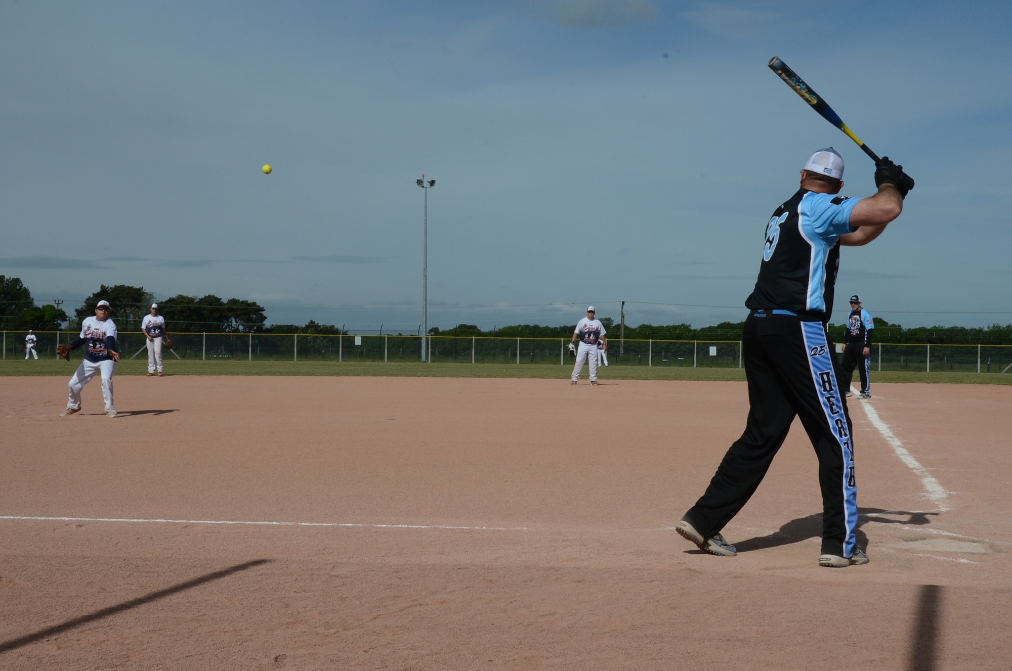 ROYAL AIR FORCE LAKENHEATH, England – Tech. Sgt. Christopher Bast, 48th Maintenance Group quality assurance inspector, prepares to swing during the first game of a softball tournament here June 14, 2013. Men and women’s softball teams from RAF Lakenheath, Ramstein Air Base, Germany, Aviano Air Base, Italy, and eight other teams from different U.S. Air Forces in Europe bases were invited to the 2nd annual softball tournament at RAF Lakenheath. (U.S. Air Force photo by Airman 1st Class Trevor T. McBride)

