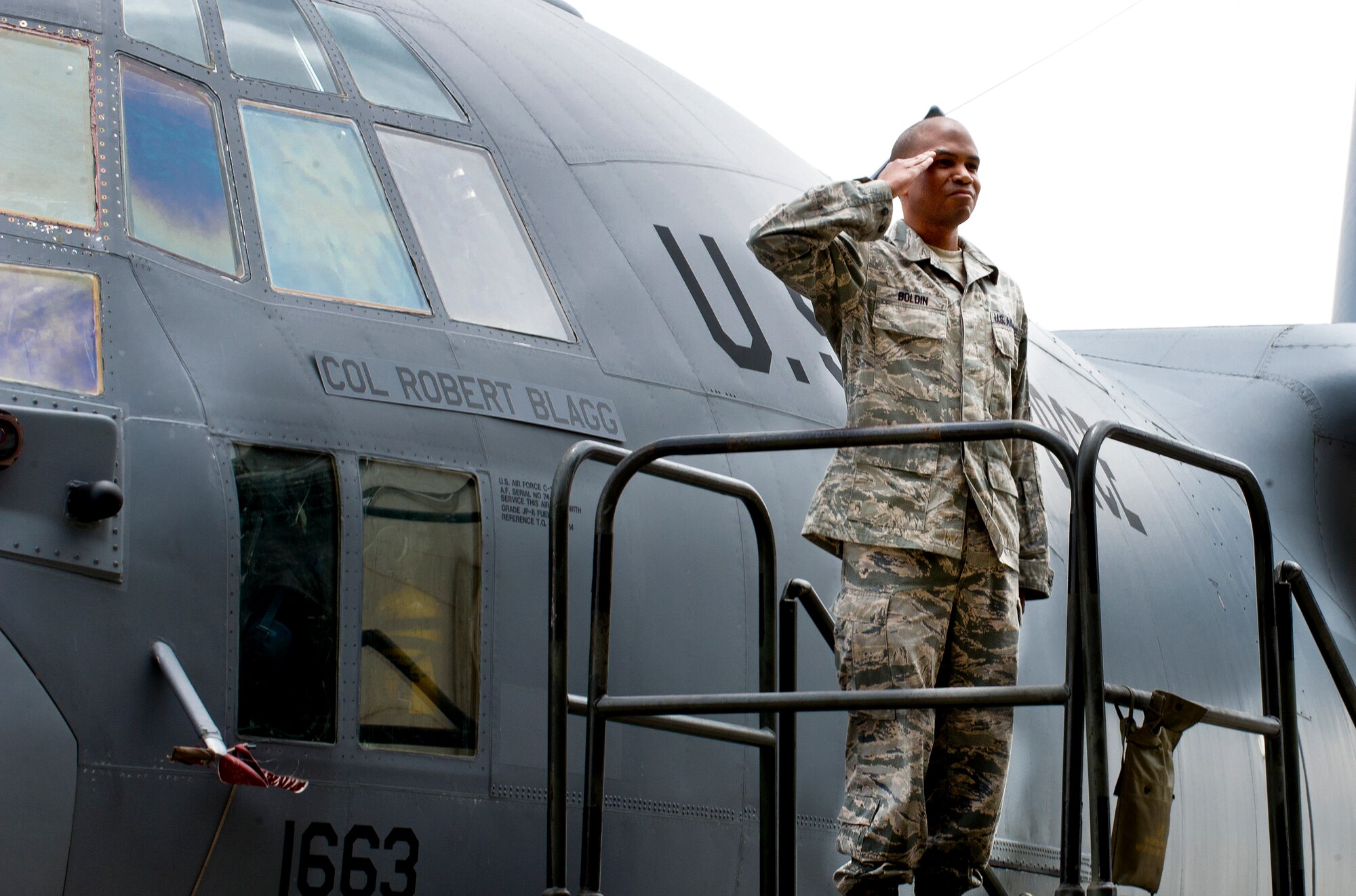 Tech. Sgt. Jarett Boldin, 374th Aircraft Maintenance Squadron, renders a salute to Col. Robert Blagg, 374th Operations Group commander, during a chance of command ceremony at Yokota Air Base, Japan June 24, 2013. Blagg replaced Col. David Gould as commander of the 374th OG. (U.S. Air Force photo by Staff Sgt Stacy Moless)