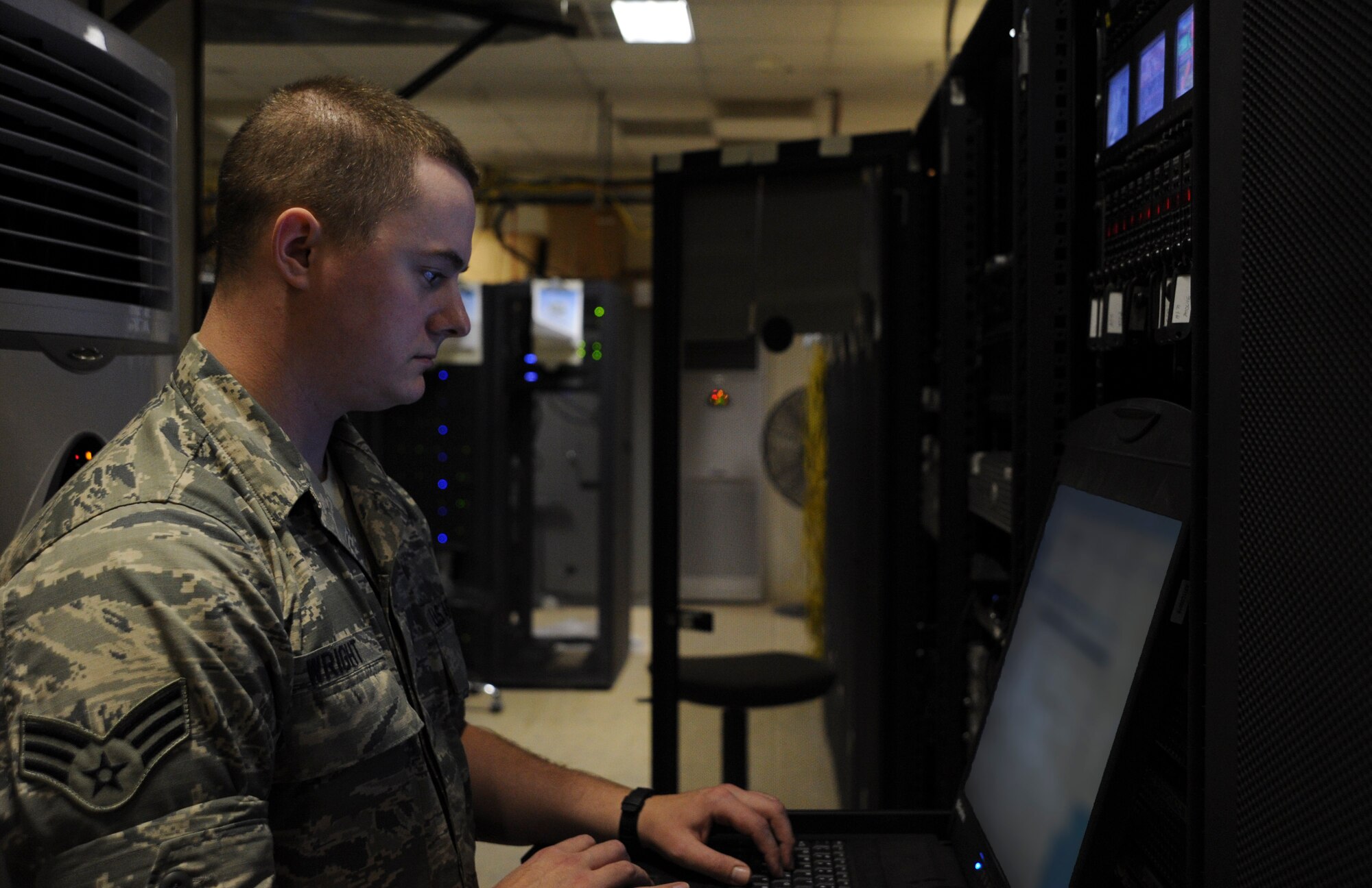 Senior Airman Andrew Wright manages a system that operates the morale servers at the 379th Air Expeditionary Wing in Southwest Asia, June 27, 2013. The 379th Expeditionary Communications Squadron Communications Focal Point works closely with the Network Control Center to resolve communication issues for customers. Wright is a 379th ECS NCC technician deployed from Joint Base Elmendorf-Richardson, Alaska. (U.S. Air Force photo/Senior Airman Bahja J. Jones)