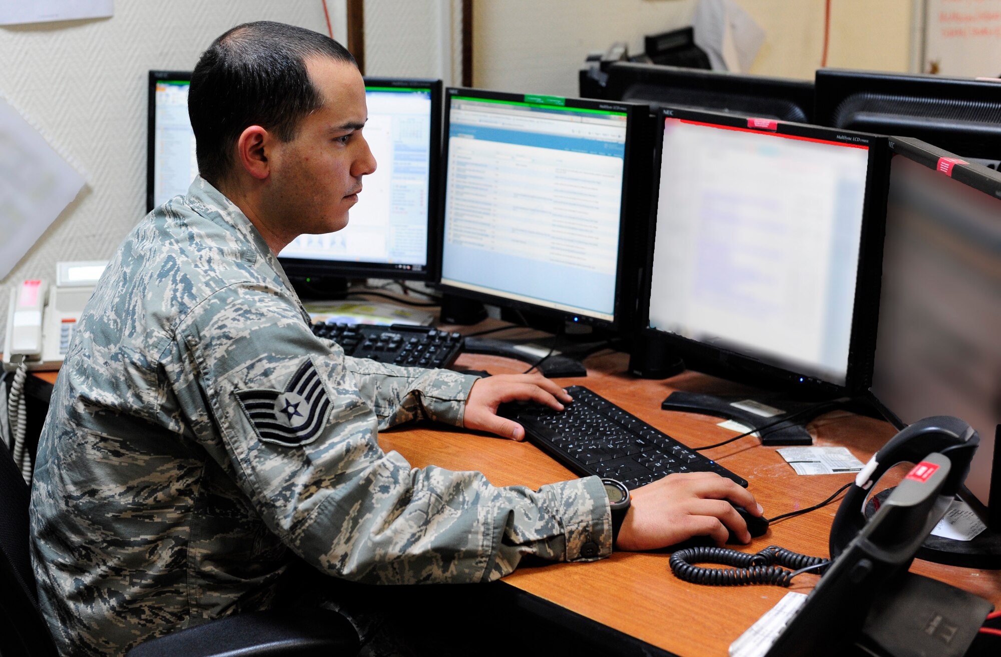 Tech. Sgt. Arthur Martinez works on a helpdesk ticket at the 379th Air Expeditionary Wing in Southwest Asia, June 20, 2013. Martinez is the 379th Expeditionary Communications Squadron Communication Focal Point Maintenance Operations Center lead deployed from Hensley Field Air Guard Station, Texas. (U.S. Air Force photo/Senior Airman Bahja J. Jones) 