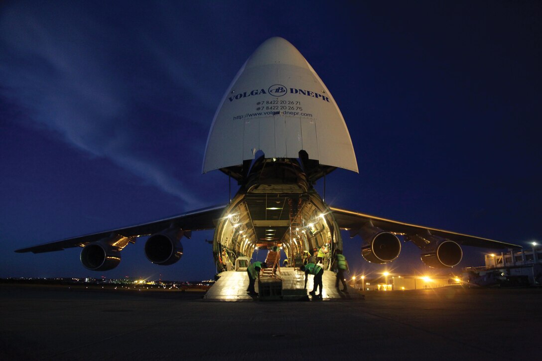 The crew of an Antonov An-124 cargo aircraft prepares to load three CH-46E Sea Knight helicopters June 17 at Marine Corps Air Station Futenma. The CH-46Es are assigned to Marine Medium Helicopter Squadron 262, Marine Aircraft Group 36, 1st Marine Aircraft Wing, III Marine Expeditionary Force. The crew and cargo aircraft are with a Russian Federation contractor. Photo by Lance Cpl. Natalie M. Rostran