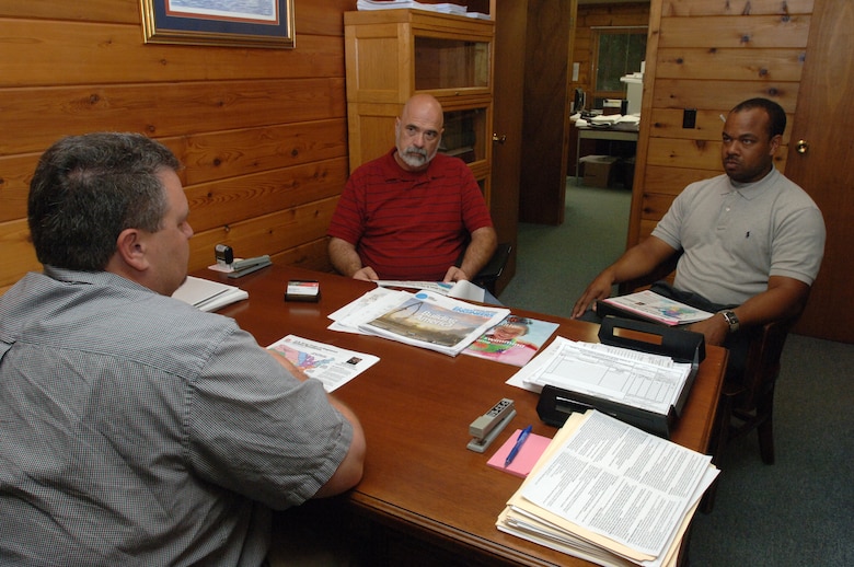 Harold Cunningham (Middle), construction teacher, and Victor Bright (Right), history teacher, both at Cane Ridge High School, receive a briefing June 5, 2013 from Jesse Pullen, U.S. Army Corps of Engineers resident engineer at the Mid Cumberland Construction Office at J. Percy Priest Lake in Nashville, Tenn. The Corps hosted them as part of a teacher externship designed to develop project based learning curriculum for science, technology, engineering and mathematics subjects.