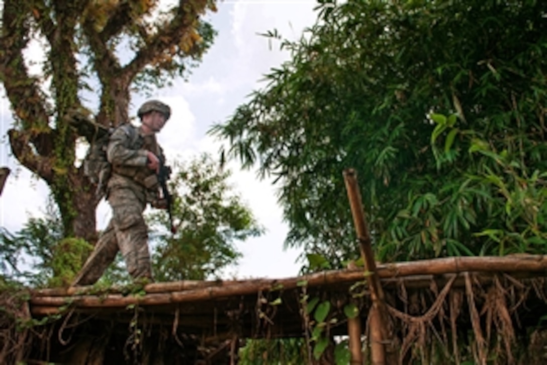 U.S. Army 1st Lt. Shane Joyce leads a patrol across a bridge during field training exercise Garuda Shield with the Indonesian Army’s 17th Airborne Brigade, 1st Infantry Division, in West Java, Indonesia, on June 18, 2013.  Joyce is a platoon leader with the 82nd Airborne Division’s 1st Brigade Combat Team.  Garuda Shield is annual exercise between the U.S. and Indonesian armies.  