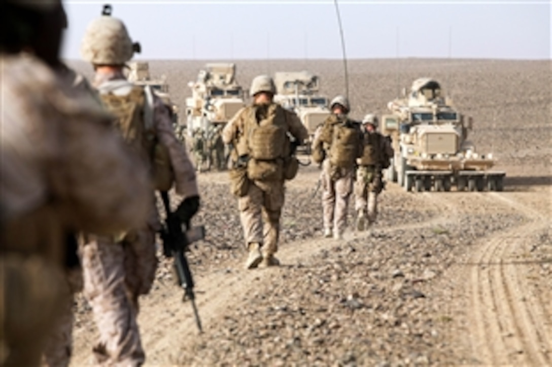 U.S. Marines and sailors move to link up with Georgian soldiers while conducting Operation Northern Lion in Mohammad Abad village in Helmand province, Afghanistan, June 24, 2013. 