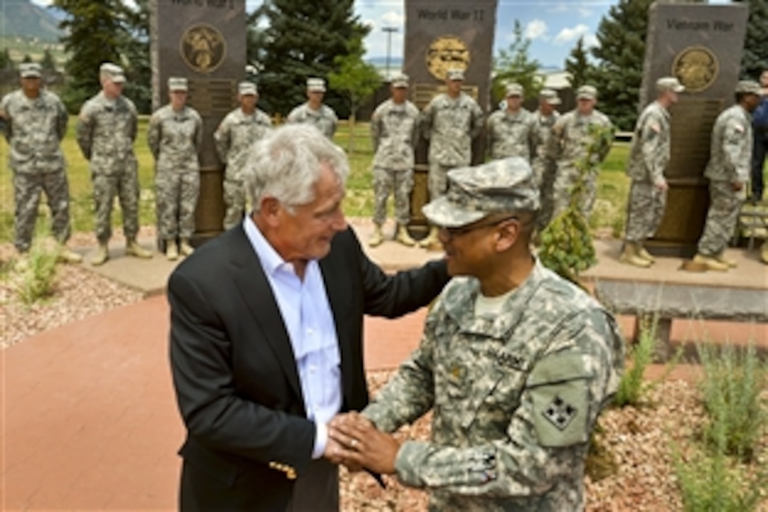 Defense Secretary Chuck Hagel thanks a soldier for his service after a troop event on Fort Carson, Colo., June 28, 2013. Hagel is on a two-day tour of installations in Colorado.