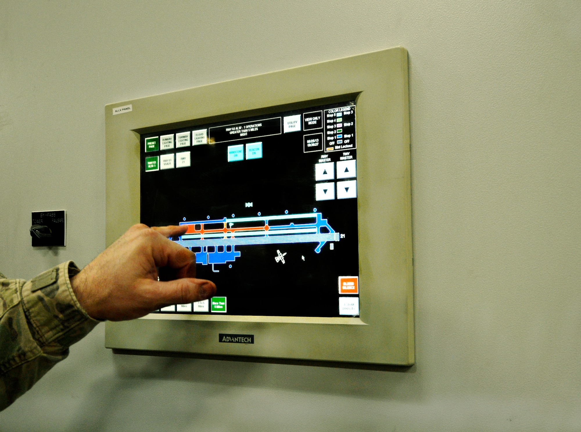 Tech. Sgt. Justin Lotero, points to a position on the airfield where he plans to inspect the runway lighting at Bagram Airfield, Afghanistan, June 6.  Lotero is deployed from the 117 Air Refueling Wing, Birmingham, Ala. (U.S. Air Force photo/Staff Sgt. Stephenie Wade) 