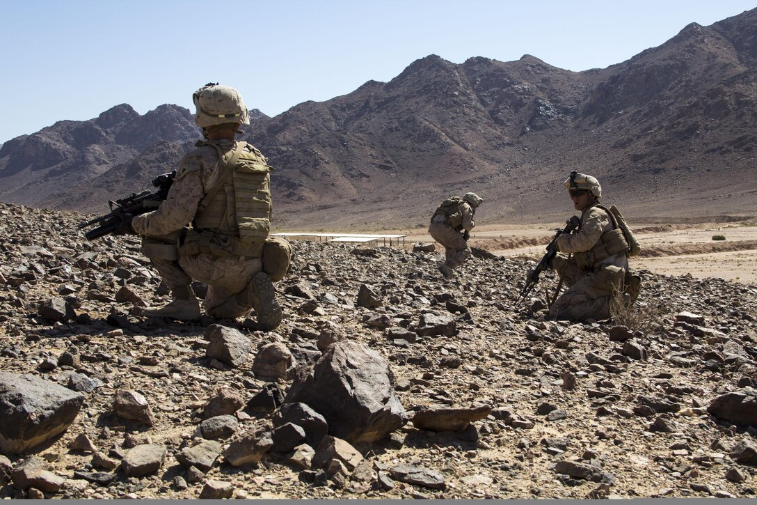 U.S. Marines assigned to Company L, Battalion Landing Team 3/2, 26th Marine Expeditionary Unit (MEU), move into position and provide security during a squad ambush exercise in Al Quweira, Jordan, during Exercise Eager Lion 2013, June 16, 2013. Exercise Eager Lion 2013 is an annual, multinational exercise designed to strengthen military-to-military relationships and enhance security and stability in the region by responding to modern-day security scenarios. The 26th MEU is deployed to the 5th Fleet area of responsibility as part of the Kearsarge Amphibious Ready Group. The 26th MEU operates continuously across the globe, providing the president and unified combatant commanders with a forward-deployed, sea-based quick reaction force. (U.S. Marine Corps photo by Lance Cpl. Juanenrique Owings, 26th MEU Combat Camera/Not Released)