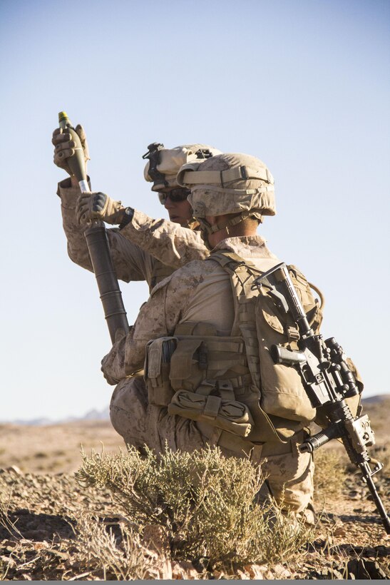 U.S. Marines assigned to Company L, Battalion Landing Team 3/2, 26th Marine Expeditionary Unit (MEU), load an M224 mortar system during a platoon attack exercise in Al Quweira, Jordan, during Exercise Eager Lion 2013, June 9, 2013. Exercise Eager Lion 2013 is an annual, multinational exercise designed to strengthen military-to-military relationships and enhance security and stability in the region by responding to modern-day security scenarios. The 26th MEU is deployed to the 5th Fleet area of responsibility as part of the Kearsarge Amphibious Ready Group. The 26th MEU operates continuously across the globe, providing the president and unified combatant commanders with a forward-deployed, sea-based quick reaction force. (U.S. Marine Corps photo by Lance Cpl. Juanenrique Owings, 26th MEU Combat Camera/Not Released)

