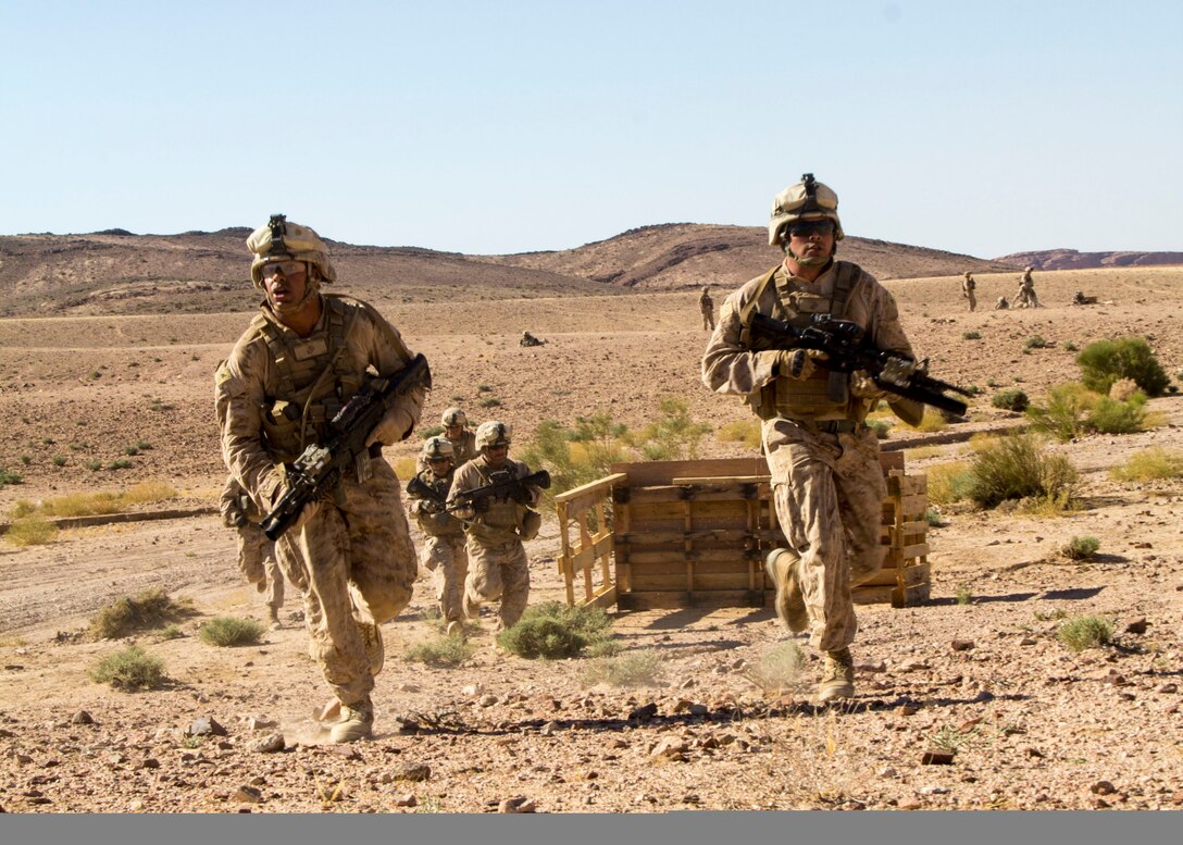 U.S. Marines and U.S. Sailors assigned to Company L, Battalion Landing Team 3/2, 26th Marine Expeditionary Unit (MEU), move into firing positions during a platoon attack exercise in Al Quweira, Jordan, during Exercise Eager Lion 2013, June 17, 2013. Exercise Eager Lion 2013 is an annual, multinational exercise designed to strengthen military-to-military relationships and enhance security and stability in the region by responding to modern-day security scenarios. The 26th MEU is deployed to the 5th Fleet area of responsibility as part of the Kearsarge Amphibious Ready Group. The 26th MEU operates continuously across the globe, providing the president and unified combatant commanders with a forward-deployed, sea-based quick reaction force. (U.S. Marine Corps photo by Lance Cpl. Juanenrique Owings, 26th MEU Combat Camera/Not Released)