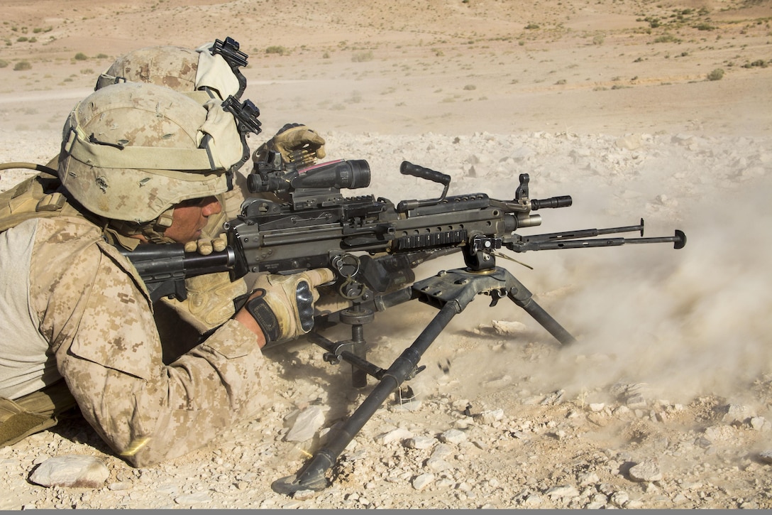 U.S. Marines assigned to Company L, Battalion Landing Team 3/2, 26th Marine Expeditionary Unit (MEU), fire an M240B machinegun during a platoon attack exercise in Al Quweira, Jordan, during Exercise Eager Lion 2013, June 17, 2013. Exercise Eager Lion 2013 is an annual, multinational exercise designed to strengthen military-to-military relationships and enhance security and stability in the region by responding to modern-day security scenarios. The 26th MEU is deployed to the 5th Fleet area of responsibility as part of the Kearsarge Amphibious Ready Group. The 26th MEU operates continuously across the globe, providing the president and unified combatant commanders with a forward-deployed, sea-based quick reaction force. (U.S. Marine Corps photo by Lance Cpl. Juanenrique Owings, 26th MEU Combat Camera/Not Released)