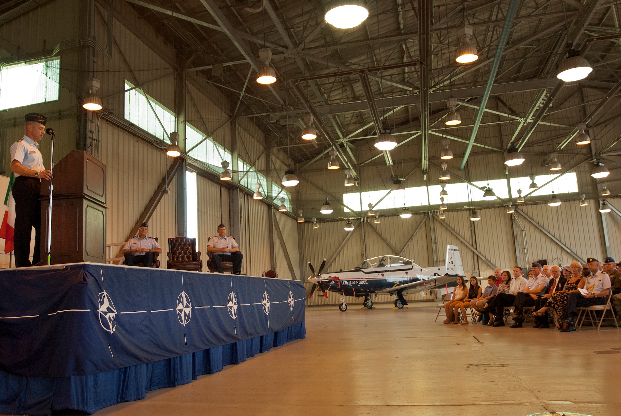 Italian Air Force Col. Paolo Baldasso speaks during his change of command ceremony at Sheppard Air Force Base, Texas June 28. German Air Force Col. Eberhard von Wintzingerode-Knorr relinquished command of the 80th Operations Group to Baldasso, marking the first time in 33 years anyone other than a German Airman has held the position. Col. Lance R. Bunch, 80th Flying Training Wing commander, presided over the ceremony. (U.S. Air Force photo/Staff Sgt. Mike Meares/Released)