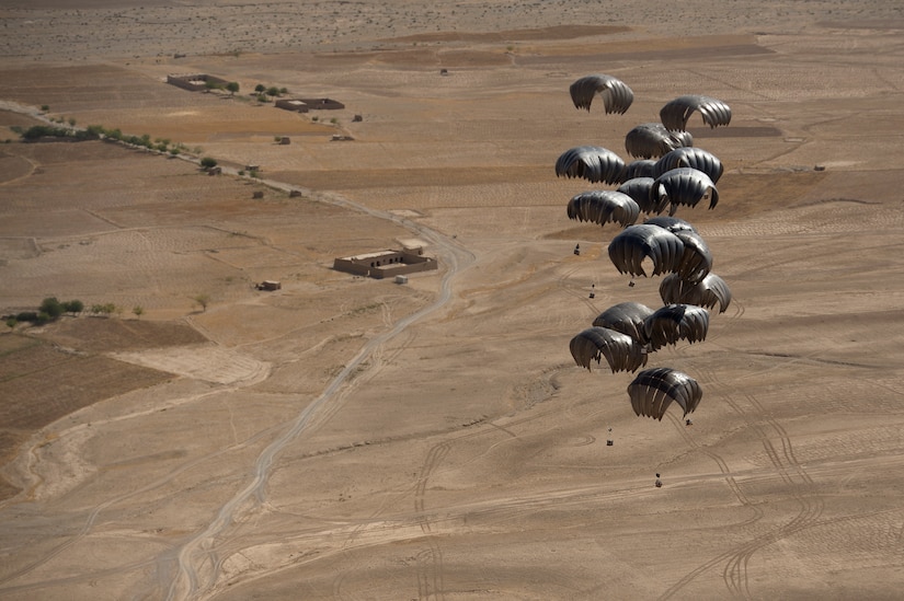 Pallets from an 816th Expeditionary Airlift Squadron C-17A Globemaster III drift over the outskirts of Ghorak, Kandahar province, Afghanistan, June 27, 2013. The Globemaster crew is deployed from Joint Base Charleston, S.C. (U.S. Air Force Photo/Master Sgt. Ben Bloker)