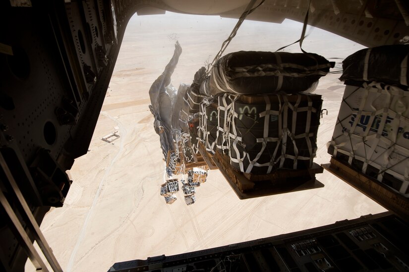 Pallets from an 816th Expeditionary Airlift Squadron C-17A Globemaster III drift over the outskirts of Ghorak, Kandahar province, Afghanistan, June 27, 2013. The Globemaster crew is deployed from Joint Base Charleston, S.C. (U.S. Air Force Photo/Master Sgt. Ben Bloker)