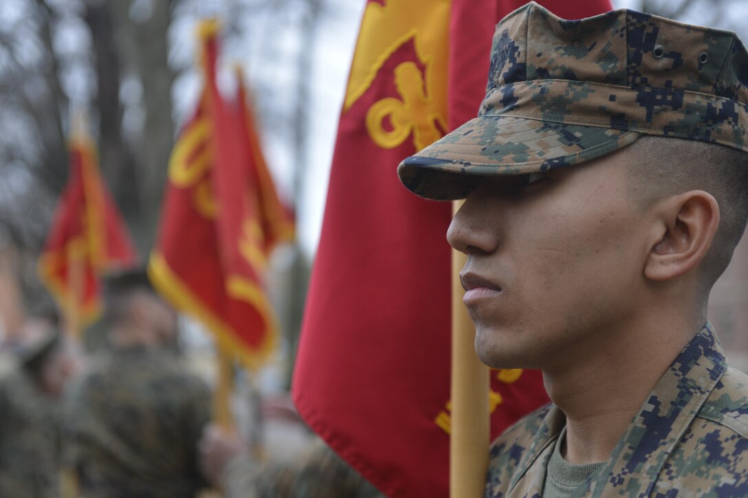 Cpl. Oscar Turcios, a supply administration and operation specialist with the Repairable Issue Point, Service Company, stands at attention during a guidon manual practice session at Corporals Course on Feb. 11. 