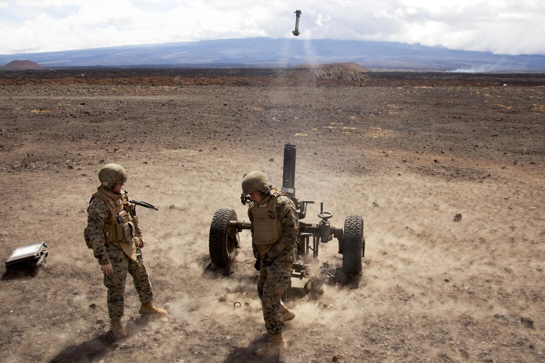 POHAKULOA TRAINING AREA, Hawaii - Lance Cpl. Travis Brixey, a field artilleryman with Alpha Battery, 1st Battalion, 12th Marine Regiment, and native of Coleman, Texas, pulls the lanyard on a M327 120 mm mortar system during Operation Spartan Fury on Pohakuloa Training Area, Hawaii, Feb. 21, 2013. The Alpha Battery Marines used the mortar system for the first time during the training exercise and were mentored by Marines from Bravo Battery to become familiar with the new weaponry. (U.S. Marine Corps photo by Lance Cpl. Nathan Knapke)