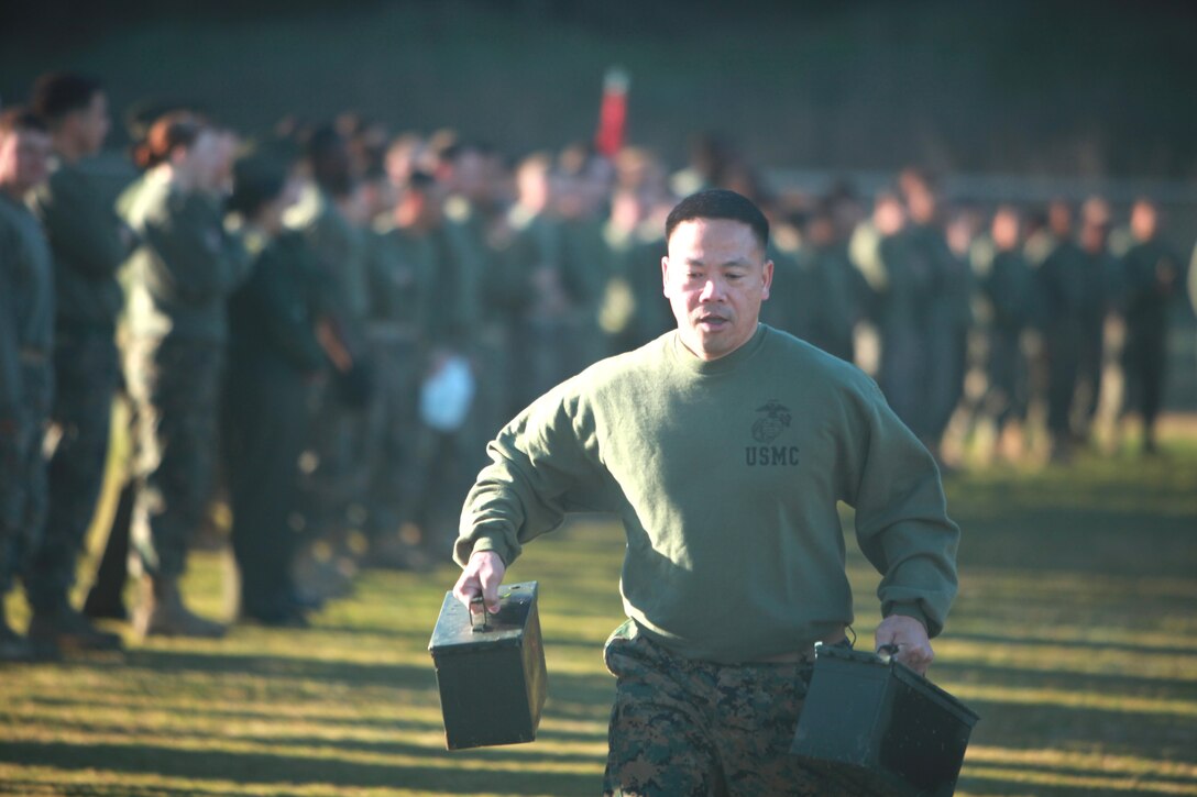A Marine with 1st Supply Battalion, Combat Logistics Regiment 15, 1st Marine Logistics Group, runs with ammo cans during the 1st Supply Bn. field meet aboard Camp Pendleton, Calif., Friday, Feb. 22, 2013. The field meet is held annually, and a trophy is awarded to the company with the best performance in events such as the ammo can run, obstacle course, and pugil stick competition.
