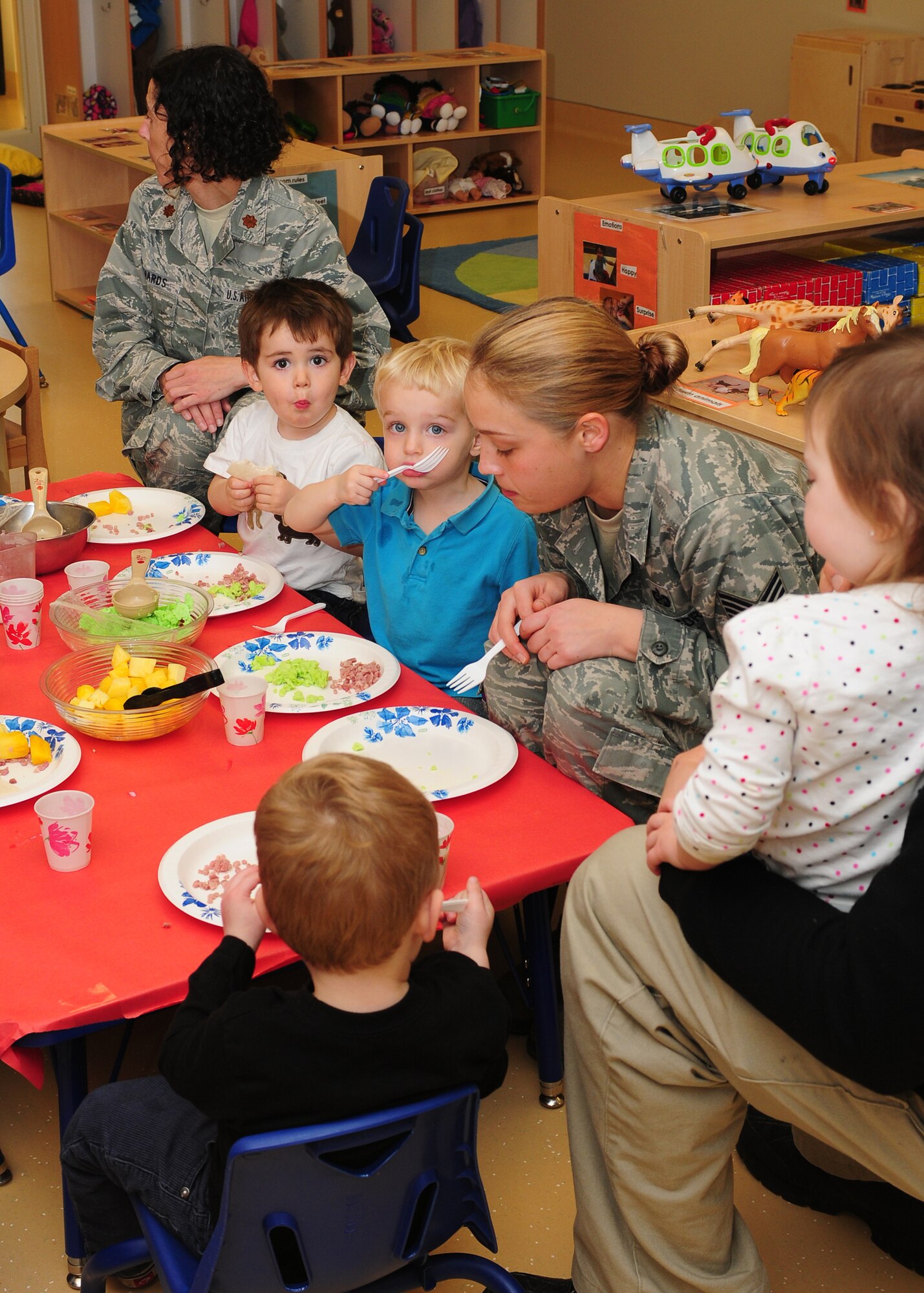 The Child Development Center staff celebrates Dr. Seuss's birthday by hosting a green eggs and ham breakfast at the CDC on Beale Air Force Base Calif., March 1, 2013. The breakfast is an annual parent involvement activity and a kick-off to Literacy Month. (U.S. Air Force photo by Senior Airman Allen Pollard/Released)