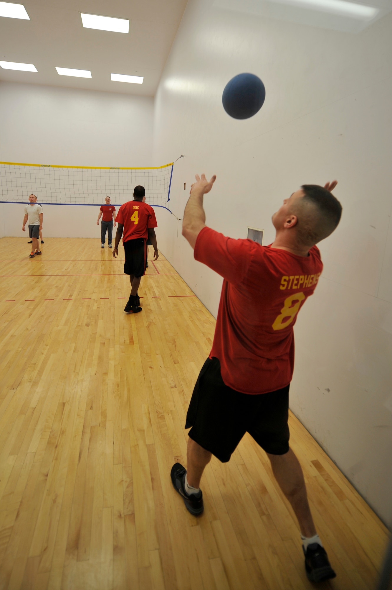 Arron Stephens, Combat Logistics Battalion 453, serves the ball to the opposing team at the Buckley Wallyball Tournament Feb. 28, 2013, at the fitness center, Buckley Air Force Base, Colo. The CLB 453 beat the 460th Force Support Squadron in the championship game after two matches. (U.S. Air Force photo by Airman 1st Class Riley Johnson/Released)