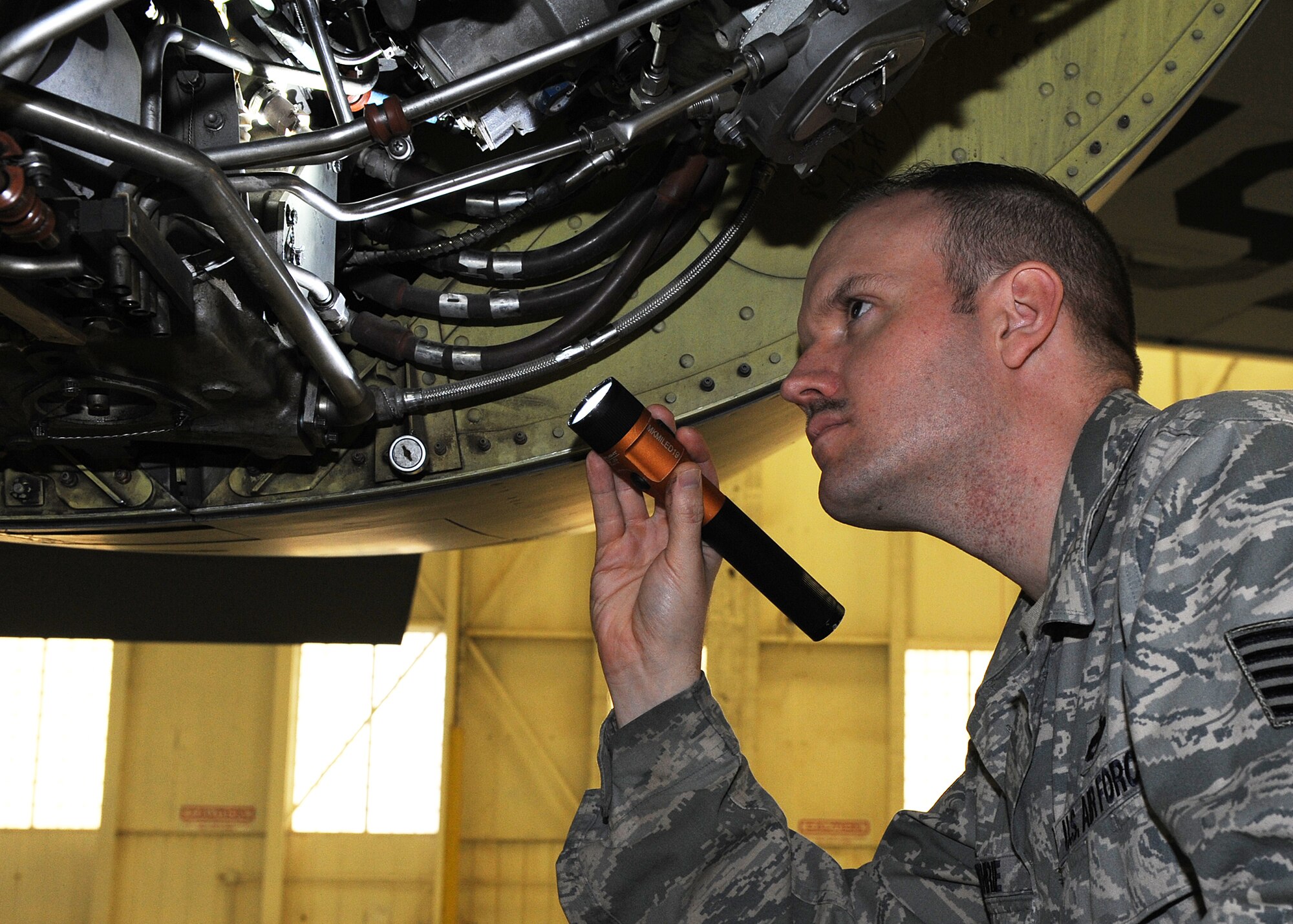 Tech. Sgt. Stephen Guthrie, 22nd Maintenance Squadron aerospace propulsion craftsman, inspects an F108 engine March 1, 2013, McConnell Air Force Base, Kan. As an aerospace propulsion craftsman, Guthrie supervises and performs periodic inspections for assigned aircraft in accordance with applicable work cards and technical manuals. Guthrie was chosen as the spotlight performer for the week of Feb. 18 to 22, 2013. (U.S. Air Force photo/ Senior Airman Katrina M. Brisbin)