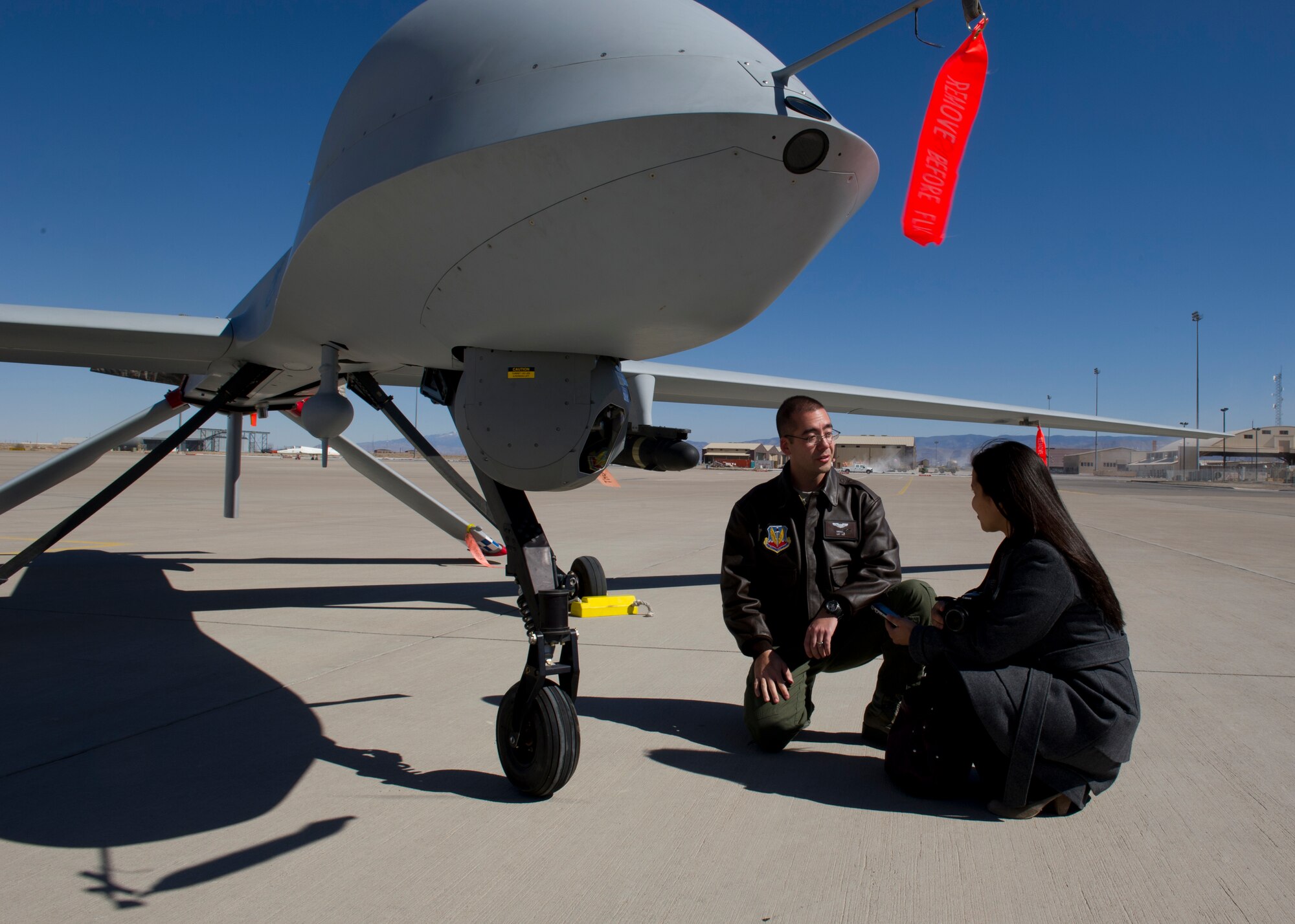 Janessa Maxilom, a reporter with the Alamogordo Daily News, interviews Capt. Randell (last name omitted due to operational security concerns), 6th Reconnaissance Squadron MQ-1 Predator instructor pilot, during a media day at Holloman Air Force Base, N.M., Feb. 28. Media days are scheduled once every quarter, with the next one tentatively scheduled for late June. (U.S. Air Force photo by Senior Airman Kasey Close/Released)