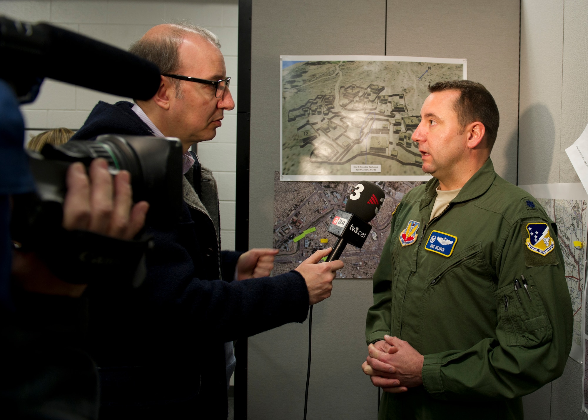 Lt. Col. Mike Weaver, 16th Training Squadron commander, speaks to media about the training mission of the MQ-1 Predators and MQ-9 Reapers at Holloman Air Force Base, N.M., Feb. 28. The MQ-1's and MQ-9’s capabilities these aircraft uniquely qualified to conduct irregular warfare operations in support of Combatant Commander objectives. (U.S. Air Force photo by Senior Airman Kasey Close/Released)