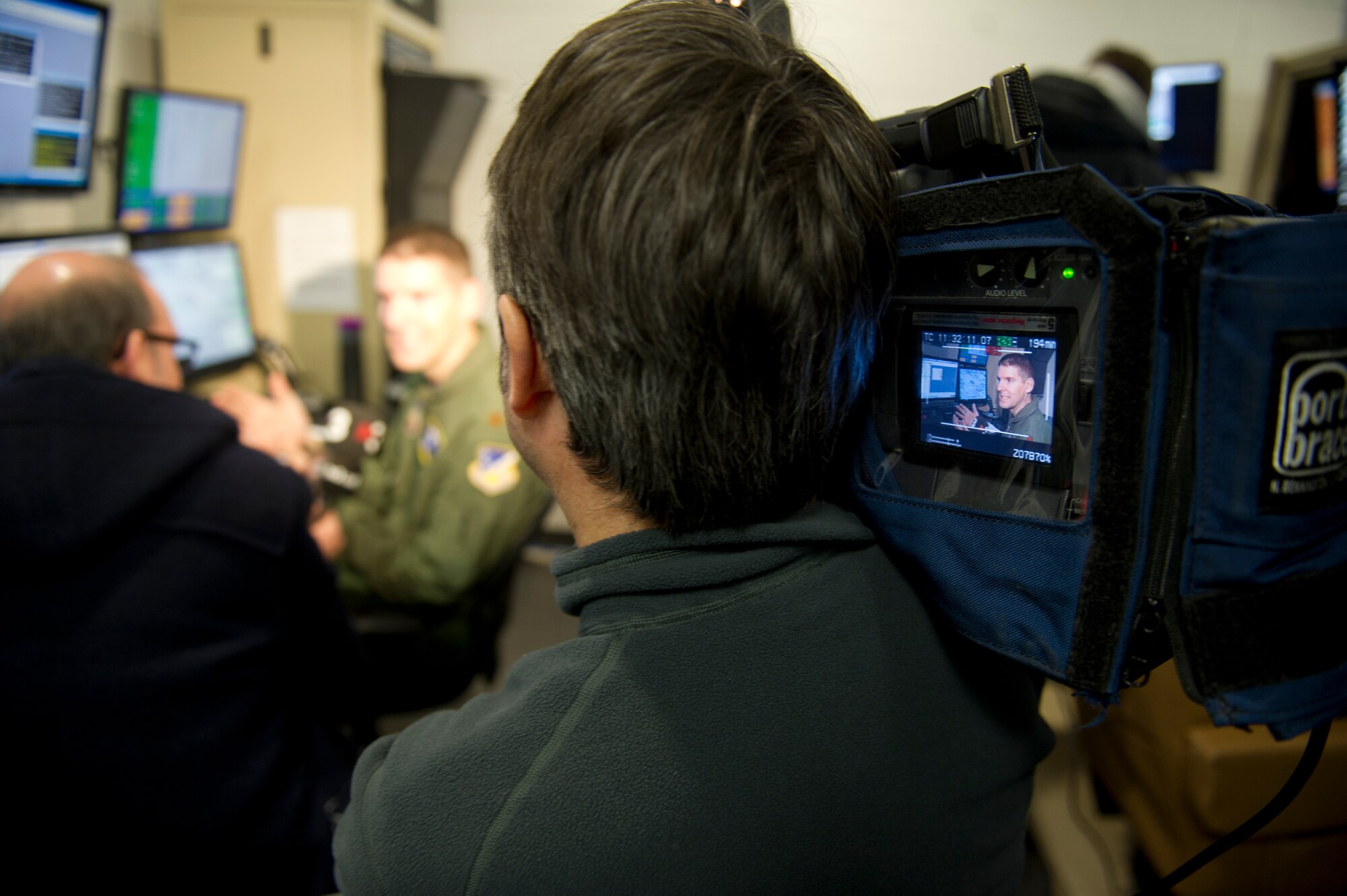 Major Dennis (last name omitted due to operational security concerns), 16th Training Squadron director of operations, speaks to the media about the MQ-1 Predator and MQ-9 Reaper simulators during a media day at Holloman Air Force Base, N.M., Feb. 28. The MQ-1 and MQ-9 are armed, multi-mission, medium-altitude, long endurance Remotely Piloted Aircraft that are employed in an armed reconnaissance role, collecting intelligence and providing direct strike capability. (U.S. Air Force photo by Senior Airman Kasey Close/Released)
