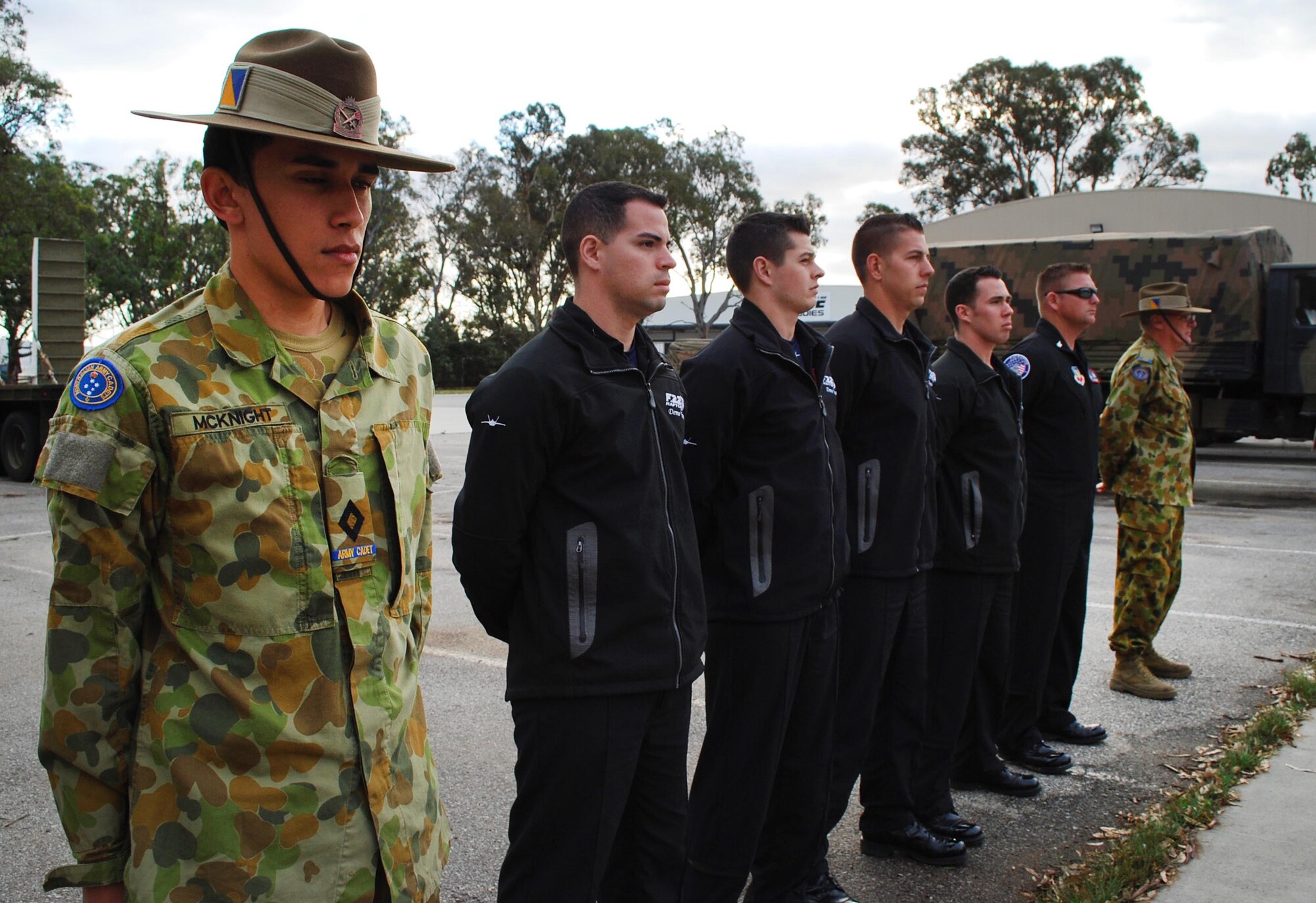 Army cadets from the Victoria Brigade stand side-by-side with five members from the F-22 Raptor demonstration team, Langley Air Base, Virginia, on Feb. 28, 2013, at the Monash Barracks, Dandenong South, Australia. The F-22 Raptor demonstration team is performing at the Australian International Airshow 2013, which is one of the largest, biennial international trade shows in the Pacific. Approximately 220 U.S. service members along with the U.S. Air Force's F-22 Raptor, C-17 Globemaster III, F-16 Fighting Falcon, B-52 Stratofortress, and KC-135 Stratotanker are supporting AIA 2013, which allows a unique opportunity for the United States to showcase its aviation prowess and strengthen military-to-military ties with our Pacific allies and partners. (U.S. Air Force photo/Airman 1st Class Kenna Jackson)
