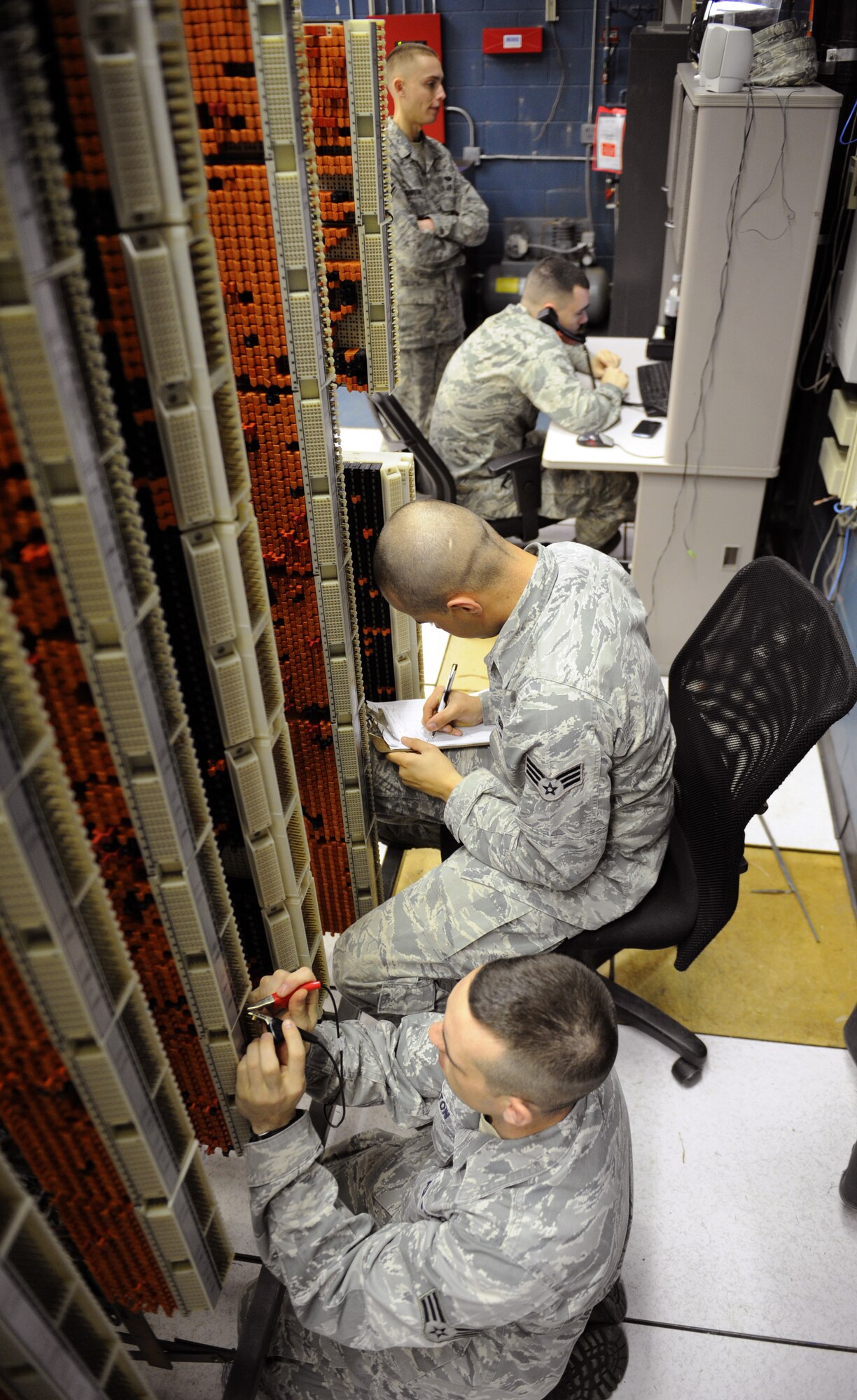 Airmen from the 2nd Communications Squadron work on the 8th Air Force's telephone systems on Barksdale Air Force Base, La., March 1. Airmen from the 2 CS cable and antenna systems and cyber transport sections maintain the telephone systems on base. (U.S. Air Force photo/Airman 1st Class Benjamin Gonsier)
