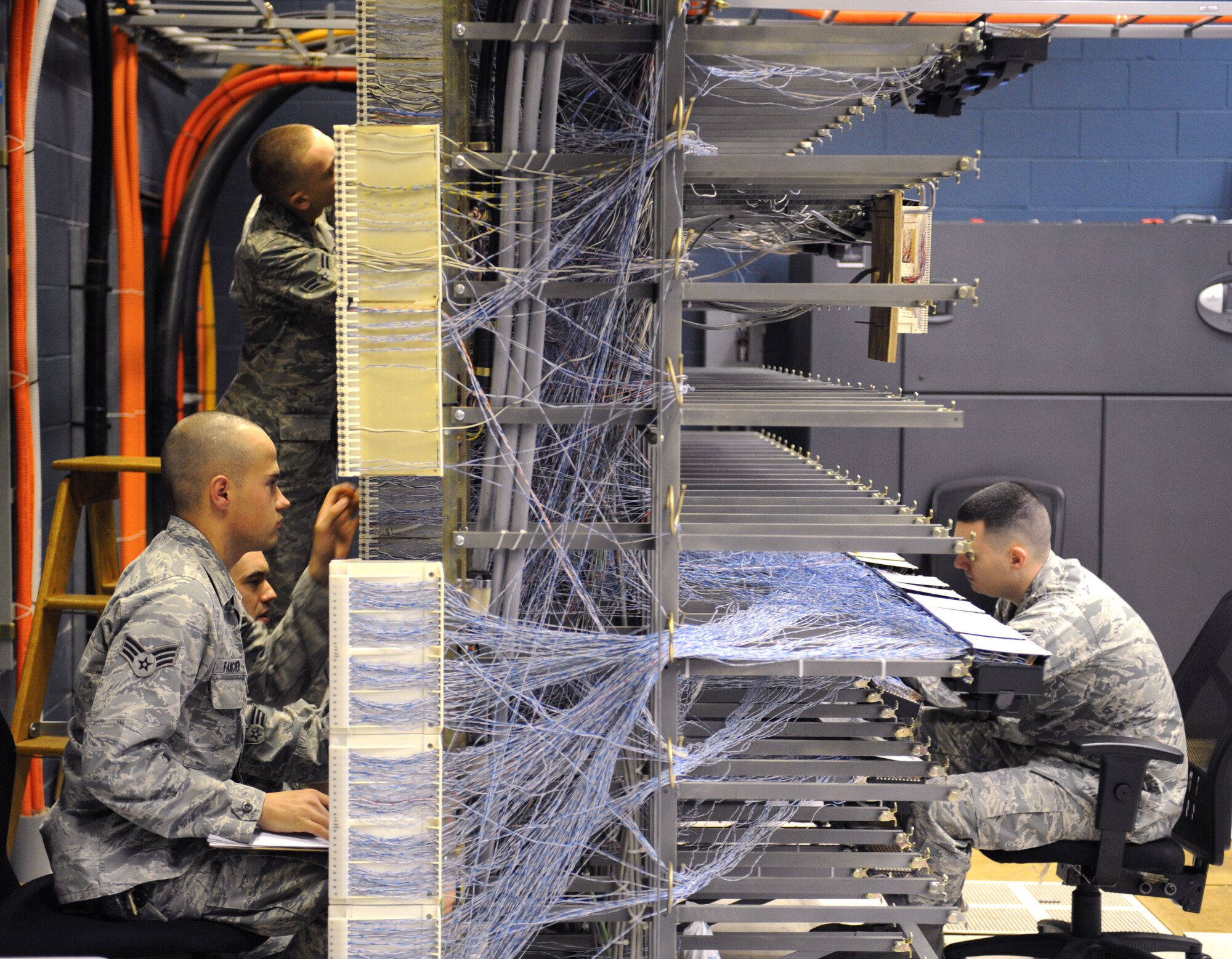 Airmen from the 2nd Communications Squadron work on the 8th Air Force's telephone systems on Barksdale Air Force Base, La., March 1. Airmen from the 2 CS cable and antenna systems and cyber transport sections maintain the telephone systems on base. (U.S. Air Force photo/Airman 1st Class Benjamin Gonsier)
