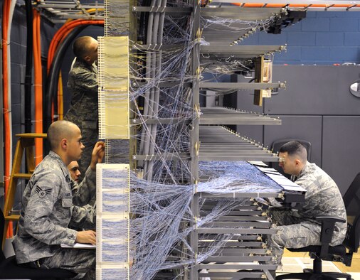 Airmen from the 2nd Communications Squadron work on the 8th Air Force's telephone systems on Barksdale Air Force Base, La., March 1. Airmen from the 2 CS cable and antenna systems and cyber transport sections maintain the telephone systems on base. (U.S. Air Force photo/Airman 1st Class Benjamin Gonsier)
