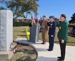 Lt. Gen. Douglas H. Owens (center), Air Education and Training command vice commander, retired Col. Dan Meyers (right), Order of Daedalians, Stinsons Flight captain, and retired Lt. Col. Dan Clark, Jack Dibrell Alamo Chapter; place the wreath during a ceremony commemorating the first military flight.  The ceremony was held at Joint Base San Antonio-Fort Sam Houston parade grounds March 1.  Flown by Lt. Benjamin Foulois March 2, 1910, the flight took place over the parade grounds at JBSA-Fort Sam Houston. Lieutenant Foulois' orders were to "teach himself to fly" in the only military aeroplane in existence at that time. His first flight lasted seven and one-half minutes and he flew the Wright "B" Flyer to 100 feet before landing. (U.S. Air Force photo by Rich McFadden)