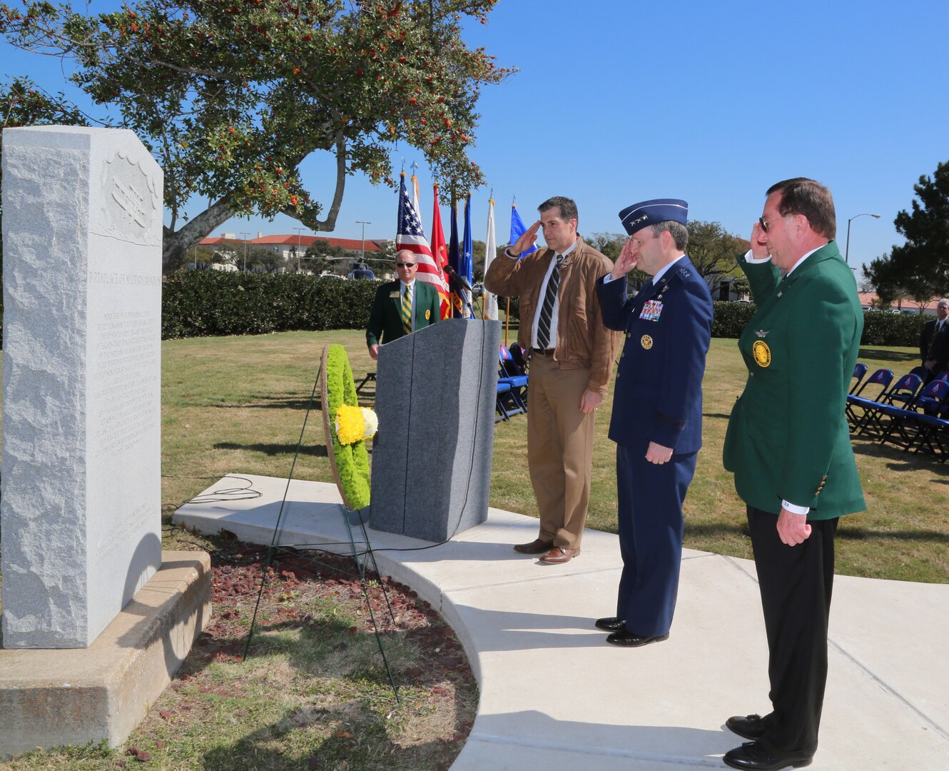 Lt. Gen. Douglas H. Owens (center), Air Education and Training command vice commander, retired Col. Dan Meyers (right), Order of Daedalians, Stinsons Flight captain, and retired Lt. Col. Dan Clark, Jack Dibrell Alamo Chapter; place the wreath during a ceremony commemorating the first military flight.  The ceremony was held at Joint Base San Antonio-Fort Sam Houston parade grounds March 1.  Flown by Lt. Benjamin Foulois March 2, 1910, the flight took place over the parade grounds at JBSA-Fort Sam Houston. Lieutenant Foulois' orders were to "teach himself to fly" in the only military aeroplane in existence at that time. His first flight lasted seven and one-half minutes and he flew the Wright "B" Flyer to 100 feet before landing. (U.S. Air Force photo by Rich McFadden)