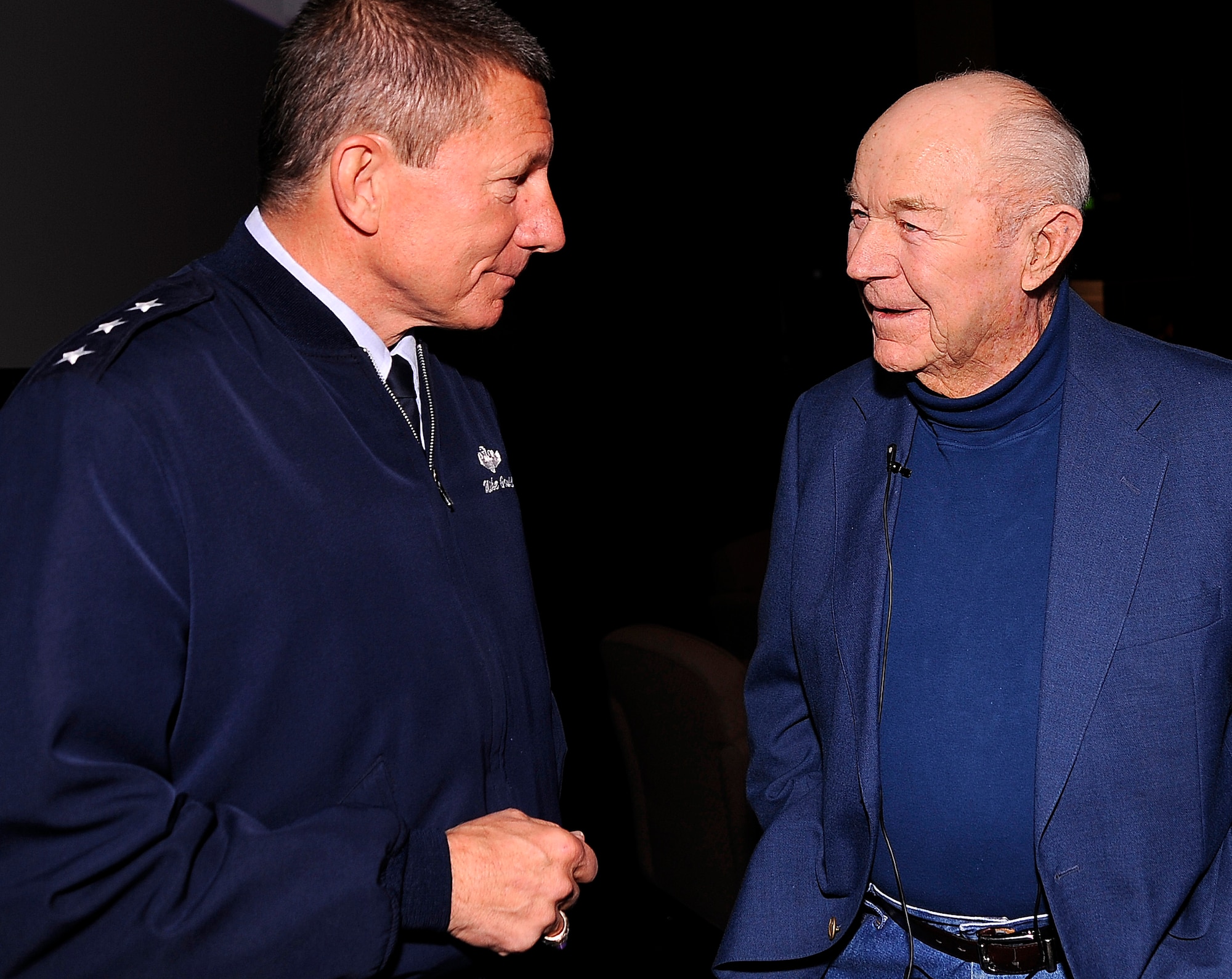 Air Force Academy Superintendent Lt. Gen. Mike Gould speaks with retired Brig. Gen. Chuck Yeager before Yeager's National Character and Leadership Symposium presentation Feb. 22, 2013. Yeager, who enlisted into the Army Air Corps in September 1941, made history six years later with the Air Force's first supersonic flight. (U.S. Air Force photo/Mike Kaplan)