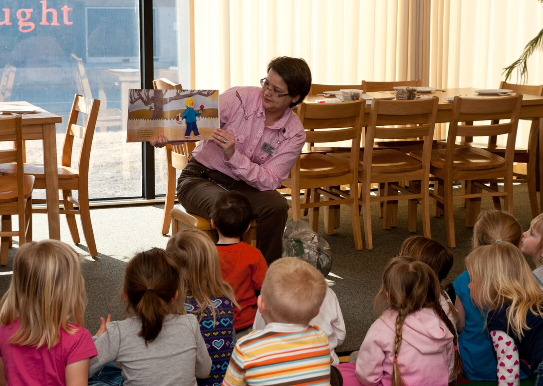 Laurie Hayes, 28th Force Support Squadron librarian, reads the book “Benny’s Pennies,” to children during Military Saves Week at the Holbrook Library on Ellsworth Air Force Base, S.D., Feb. 28, 2013. The purpose of Military Saves Week is to encourage servicemembers and their families to make a commitment to begin the journey toward financial freedom. “Benny’s Pennies” illustrated the importance of saving money and how to spend money appropriately from a child’s perspective. (U.S. Air Force photo by Airman 1st Class Alystria Maurer/Released)