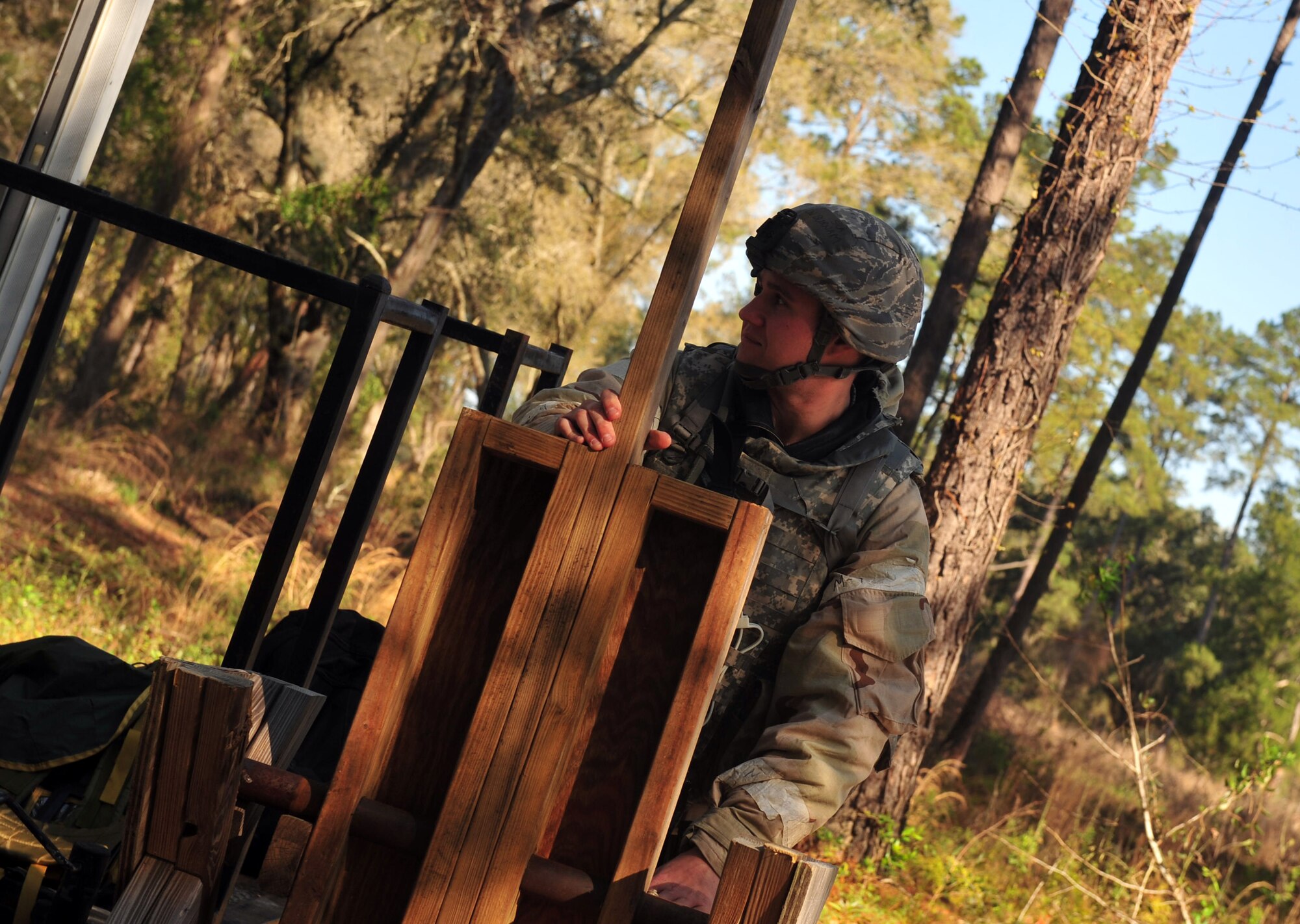 U.S. Air Force Senior Airman Justin Burnam, , a security forces augmentee from the 23d Civil Engineer Squadron, opens the gate during an operational readiness exercise at Moody Air Force Base, Ga., Feb. 28, 2013. The augmentees' job includes manning the entry control point, the defensive fighting position and acting as the quick response force. (U.S. Air Force photo by Airman 1st  Class Olivia Bumpers/Released)