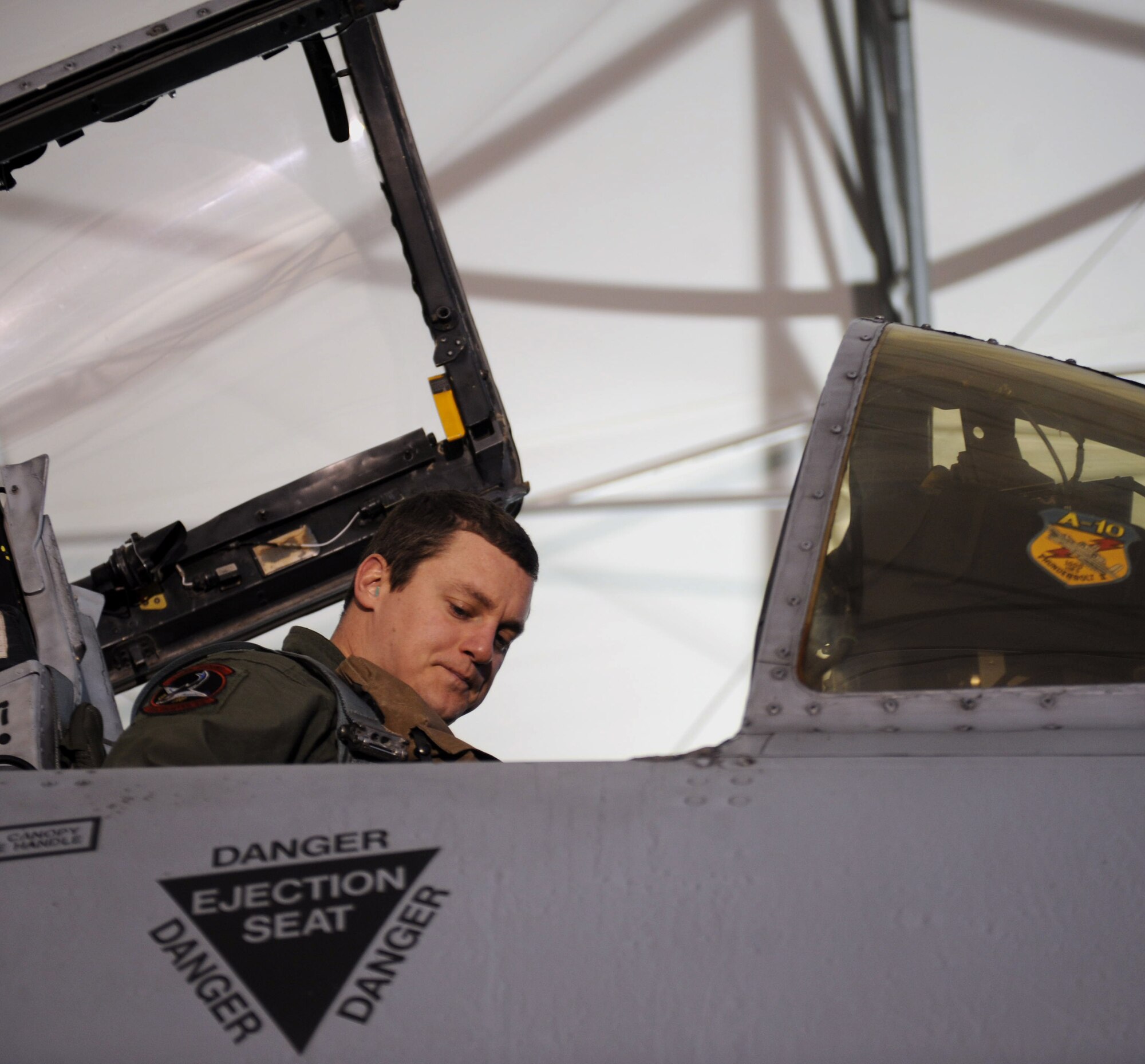 U.S. Air Force Capt. Aaron Palan, 75th Fighter Squadron A-10C Thunderbolt II pilot, puts on his seatbelt before flight at Moody Air Force Base, Ga., Feb. 28, 2013. Prior to each mission, both the pilot and crew chief perform a series of preflight checks and inspections. (U.S. Air Force photo by Airman 1st Class Olivia Bumpers/Released)