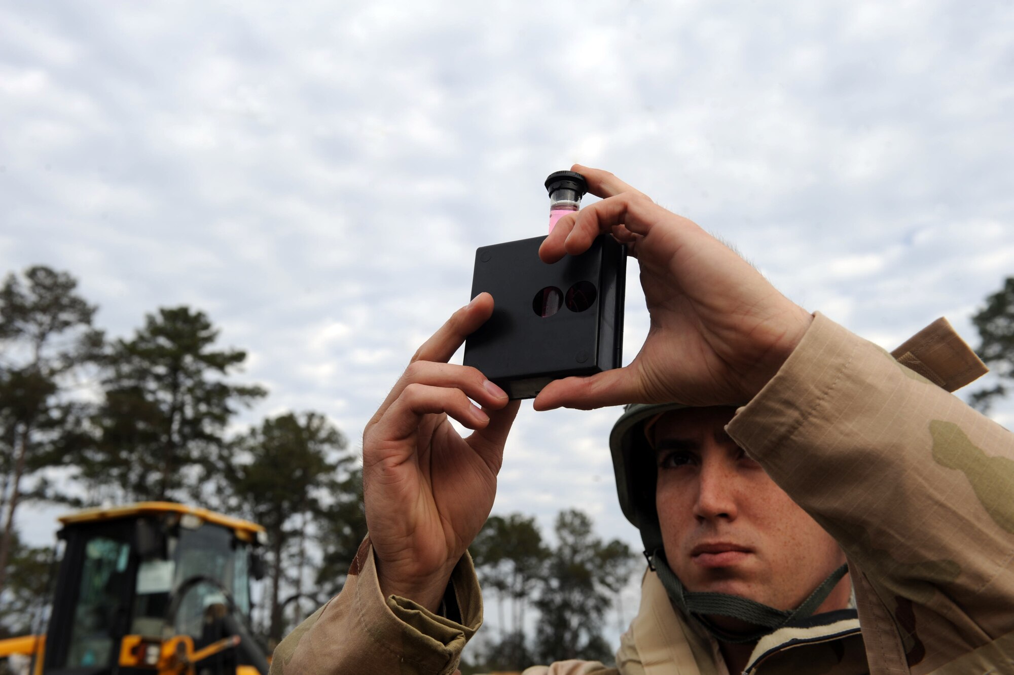 U.S. Air Force Senior Airman Robert Kost, 23d Civil Engineer Squadron, tests water samples during an operational readiness exercise at Moody Air Force Base, Ga., Feb. 27, 2013. The 23d CES takes water samples every hour to test for contaminants to ensure clean and safe drinking water for assigned Airmen. (U.S. Air Force photo by Airman 1st Class Olivia Bumpers/Released)