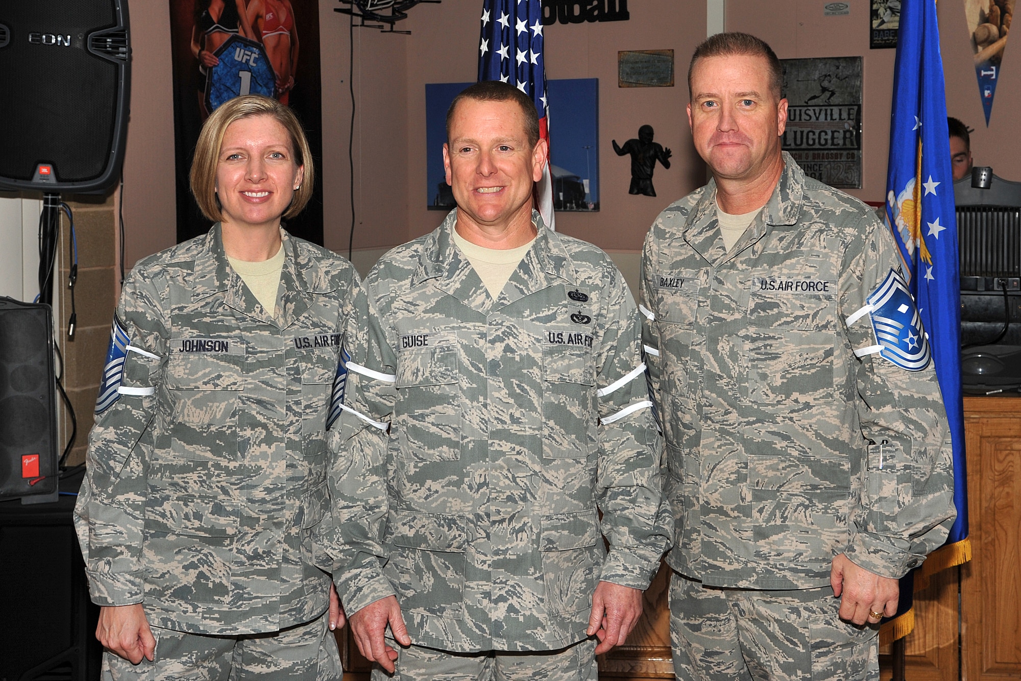 U.S. Air Force Master Sgts. Deborah Johnson and Kenneth Guise, 17th Mission Support Group, and Master Sgt. James Baxley, 17th Medical Group, pose for a photo at the Senior Master Sgt. select party on Goodfellow Air Force Base, Texas, Feb. 28, 2013. (U.S. Air Force photo/ Airman 1st Class Michael Smith)
